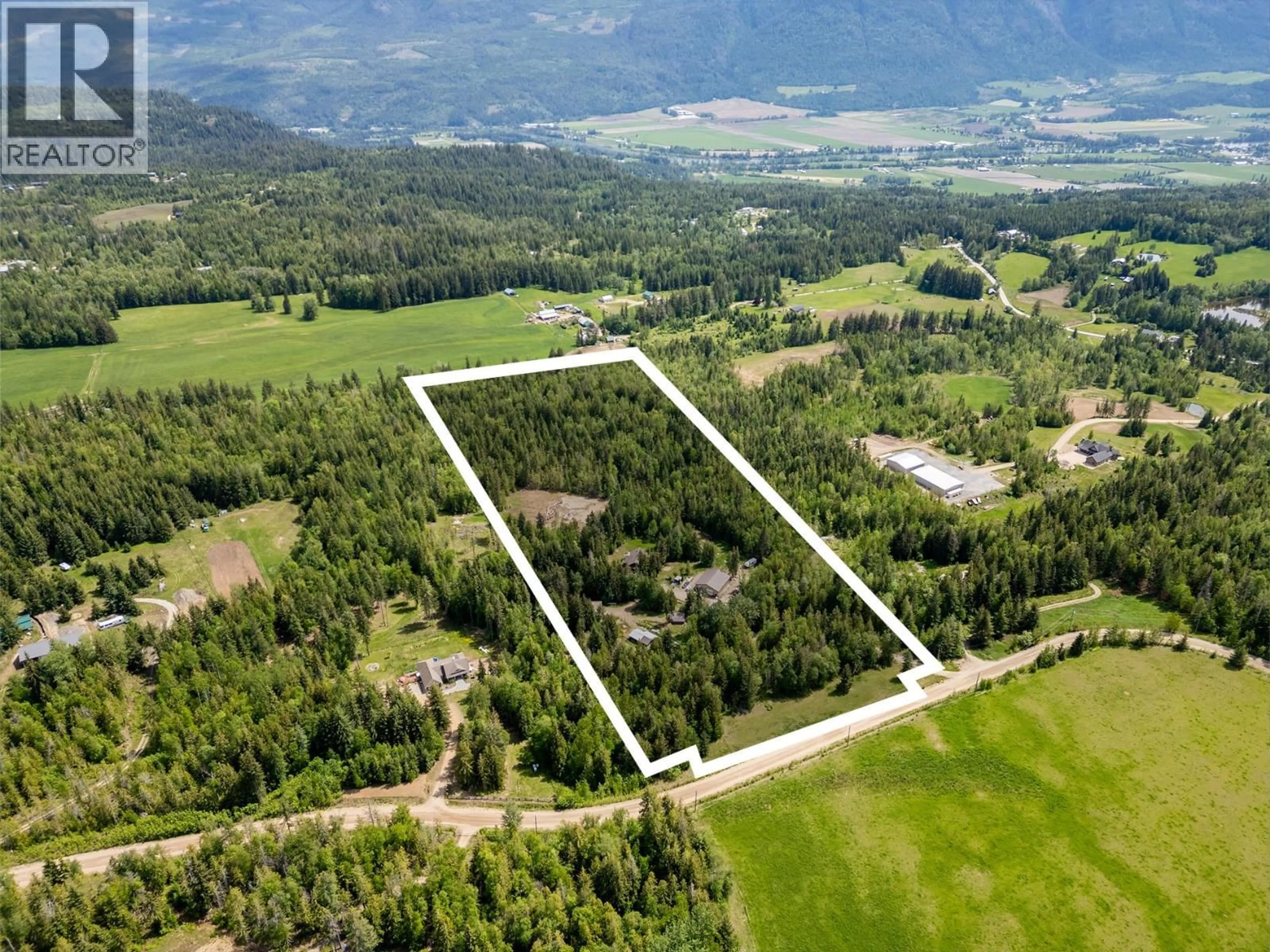 A pic from outside/outdoor area/front of a property/back of a property/a pic from drone, mountain view for 63 LIBICH ROAD, Salmon Arm British Columbia V1E2Y1