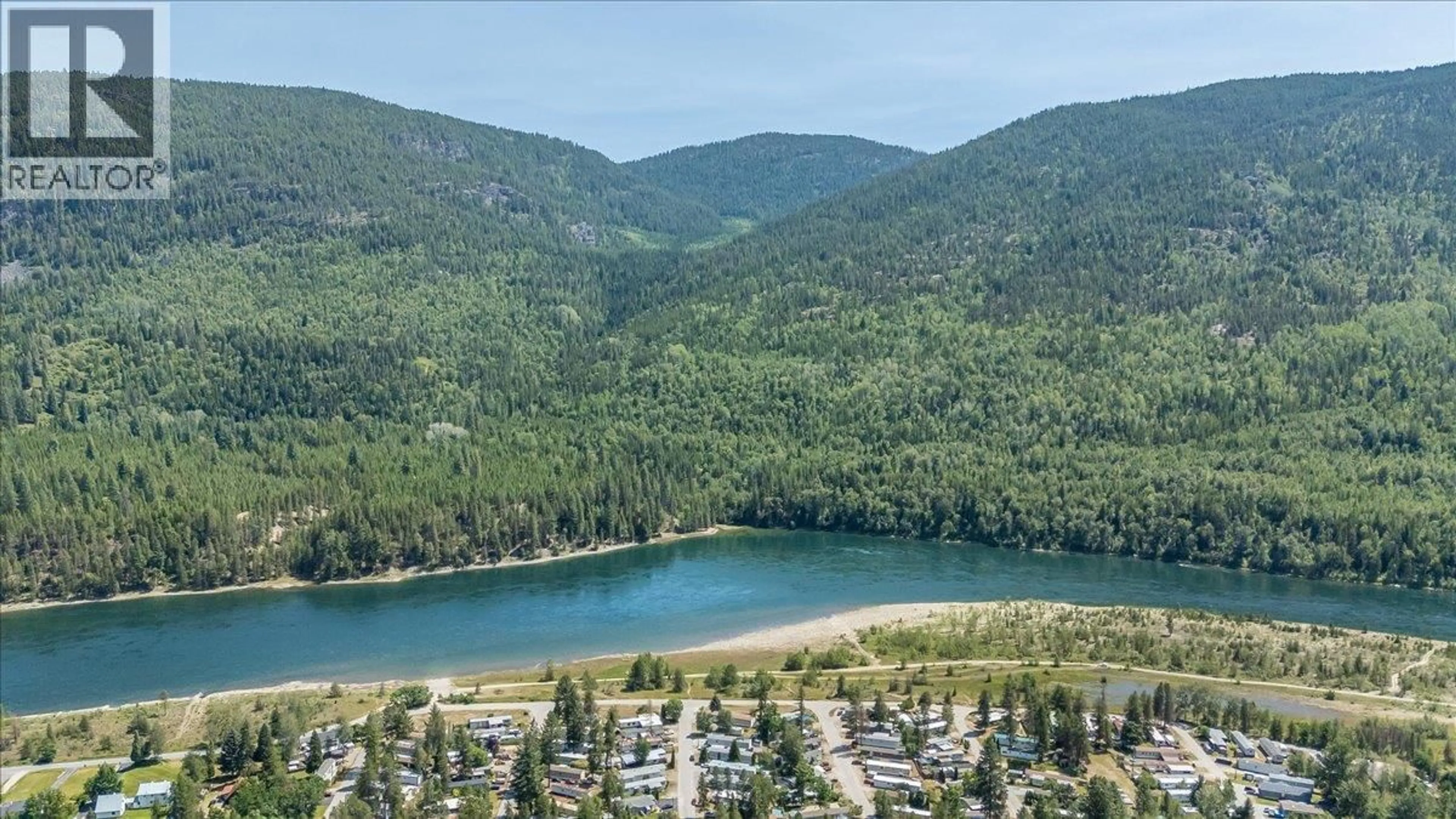 A pic from outside/outdoor area/front of a property/back of a property/a pic from drone, water/lake/river/ocean view for 41 - 500 16TH AVENUE, Genelle British Columbia V0G1G0