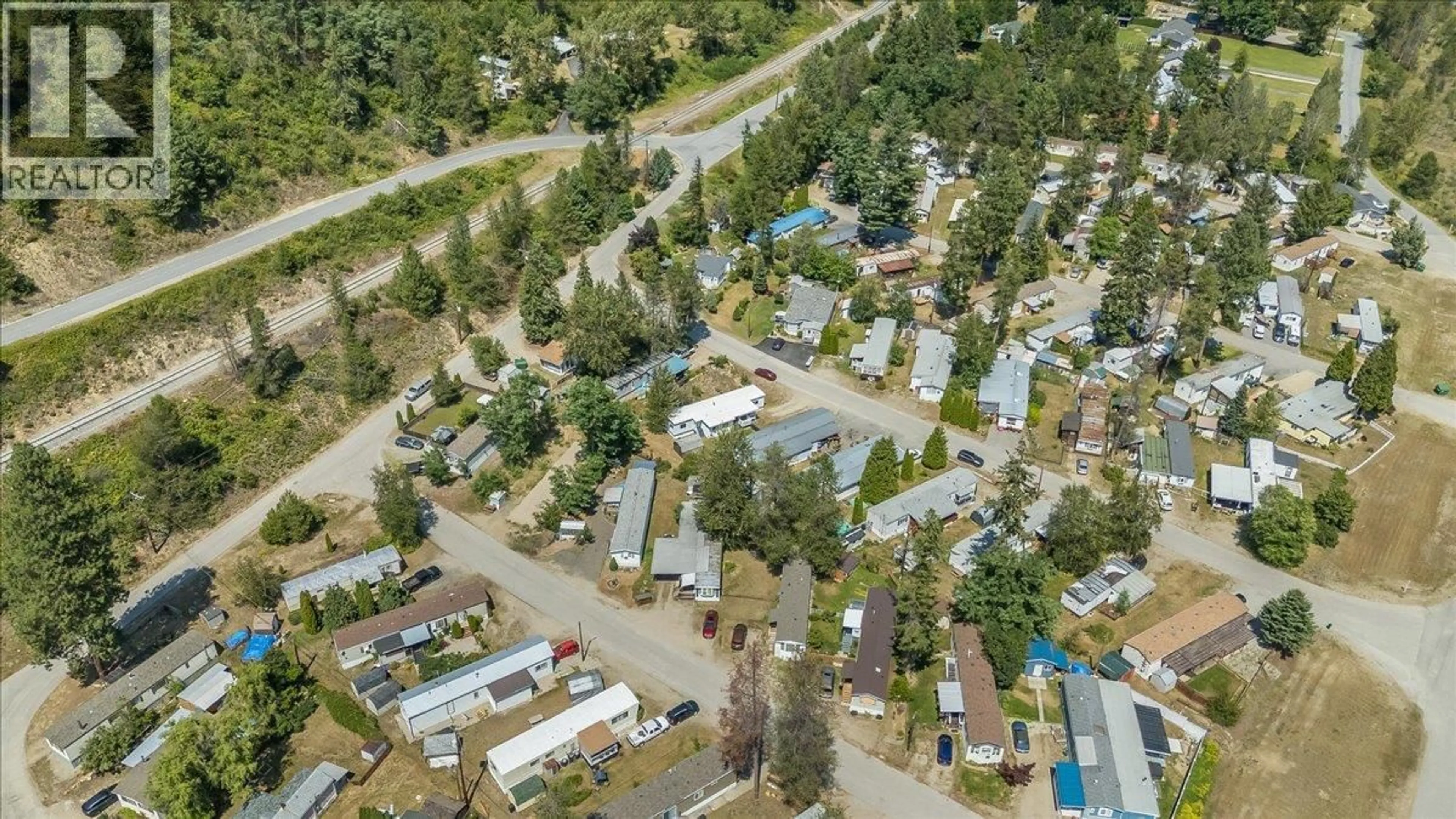 A pic from outside/outdoor area/front of a property/back of a property/a pic from drone, street for 41 - 500 16TH AVENUE, Genelle British Columbia V0G1G0