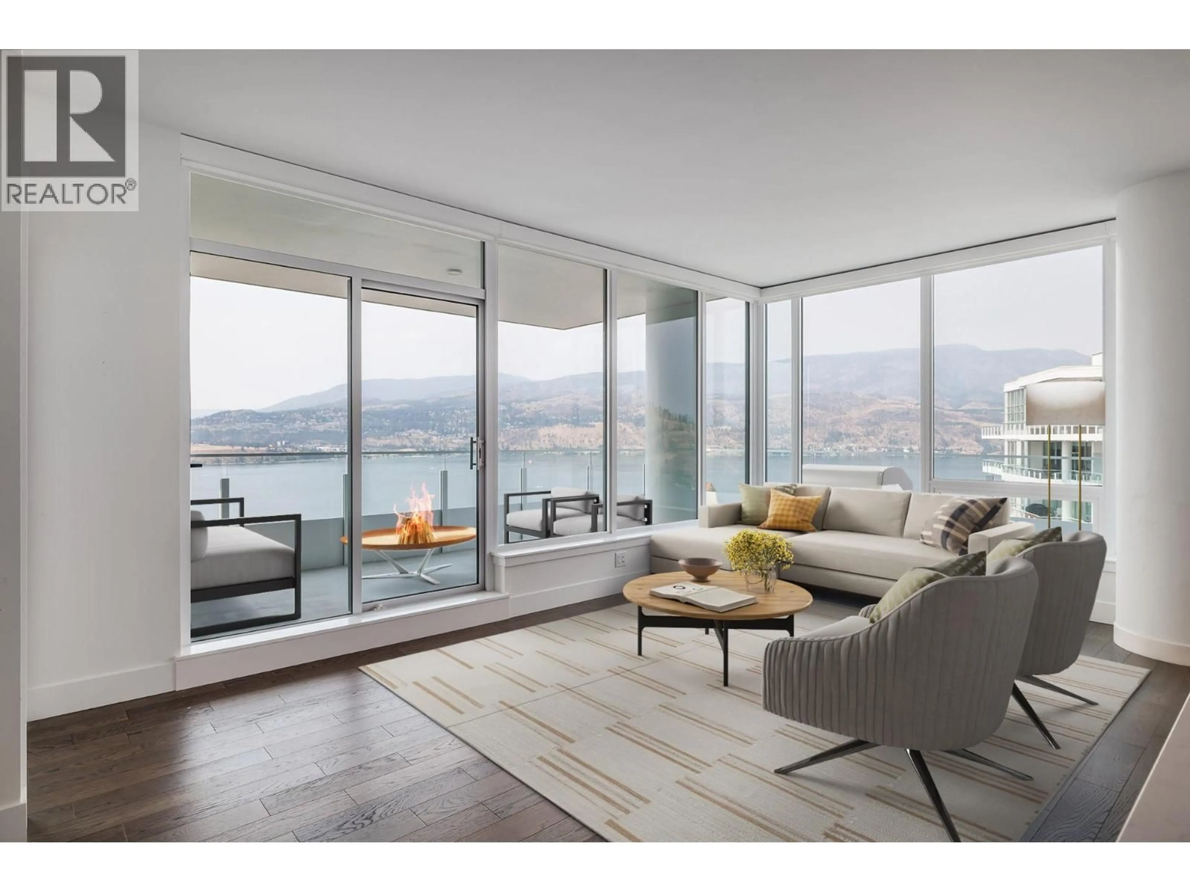 Living room with furniture, wood/laminate floor for 2905 - 1191 SUNSET DRIVE, Kelowna British Columbia V1Y9X5