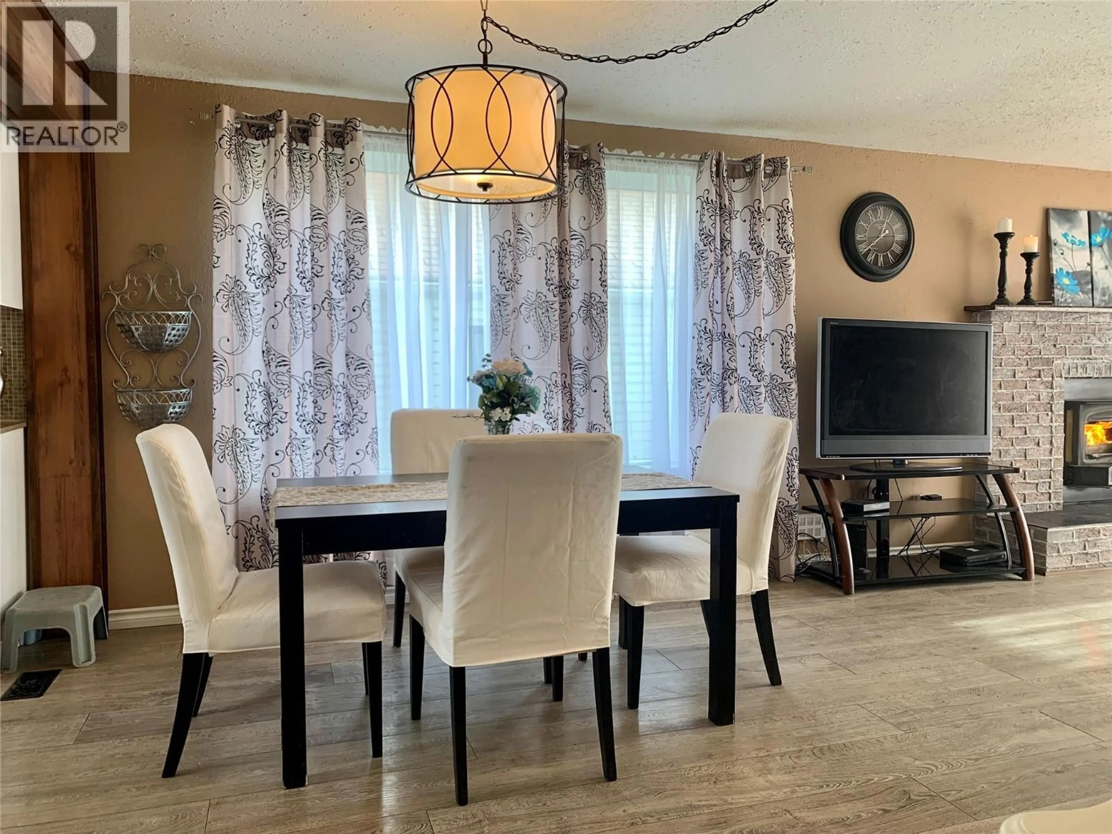 Dining room, wood/laminate floor for 1329 108 AVENUE, Dawson Creek British Columbia V1G4J2