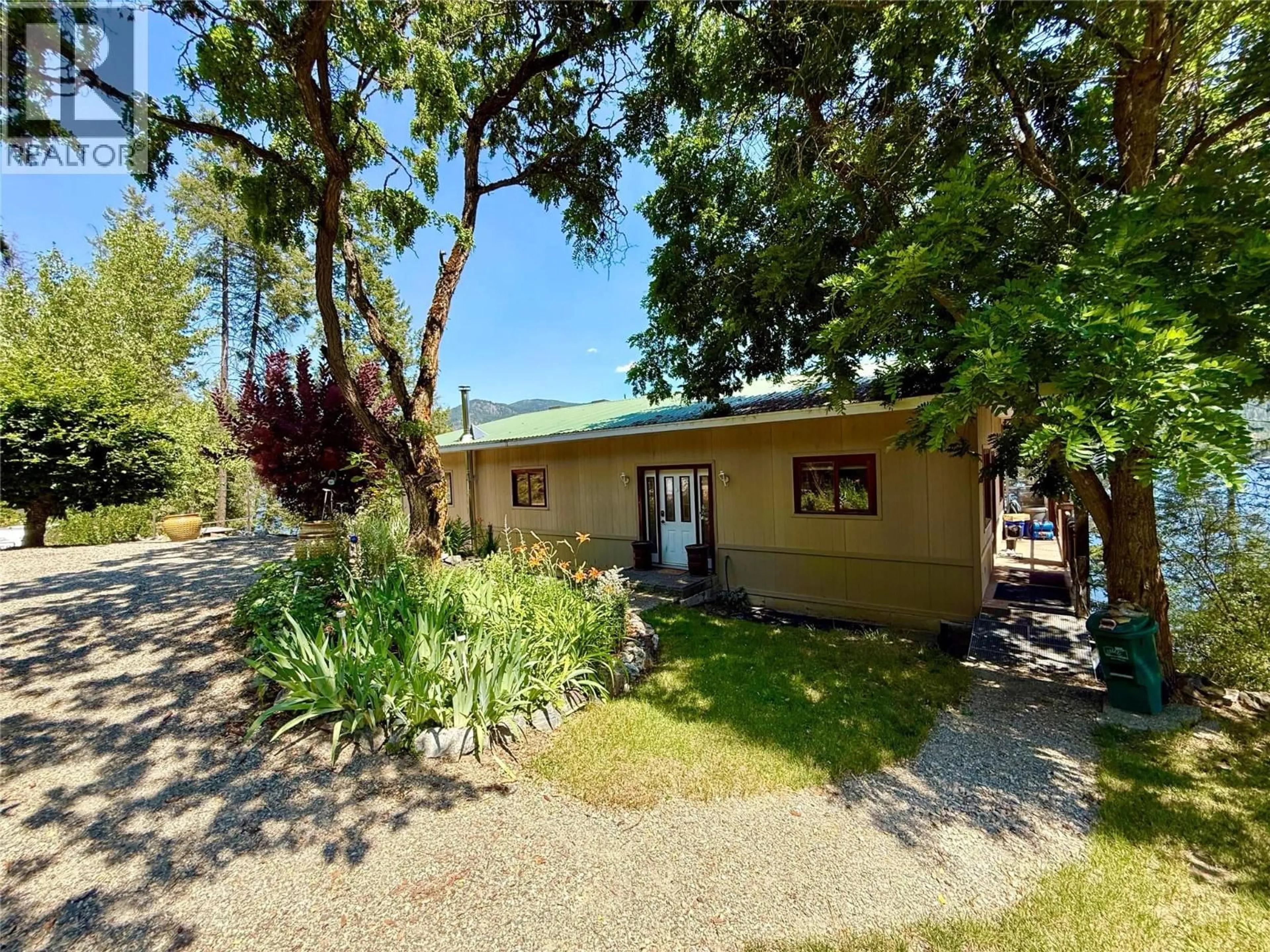 A pic from outside/outdoor area/front of a property/back of a property/a pic from drone, street for 2186 WEST LAKE DRIVE, Christina Lake British Columbia V0H1E2