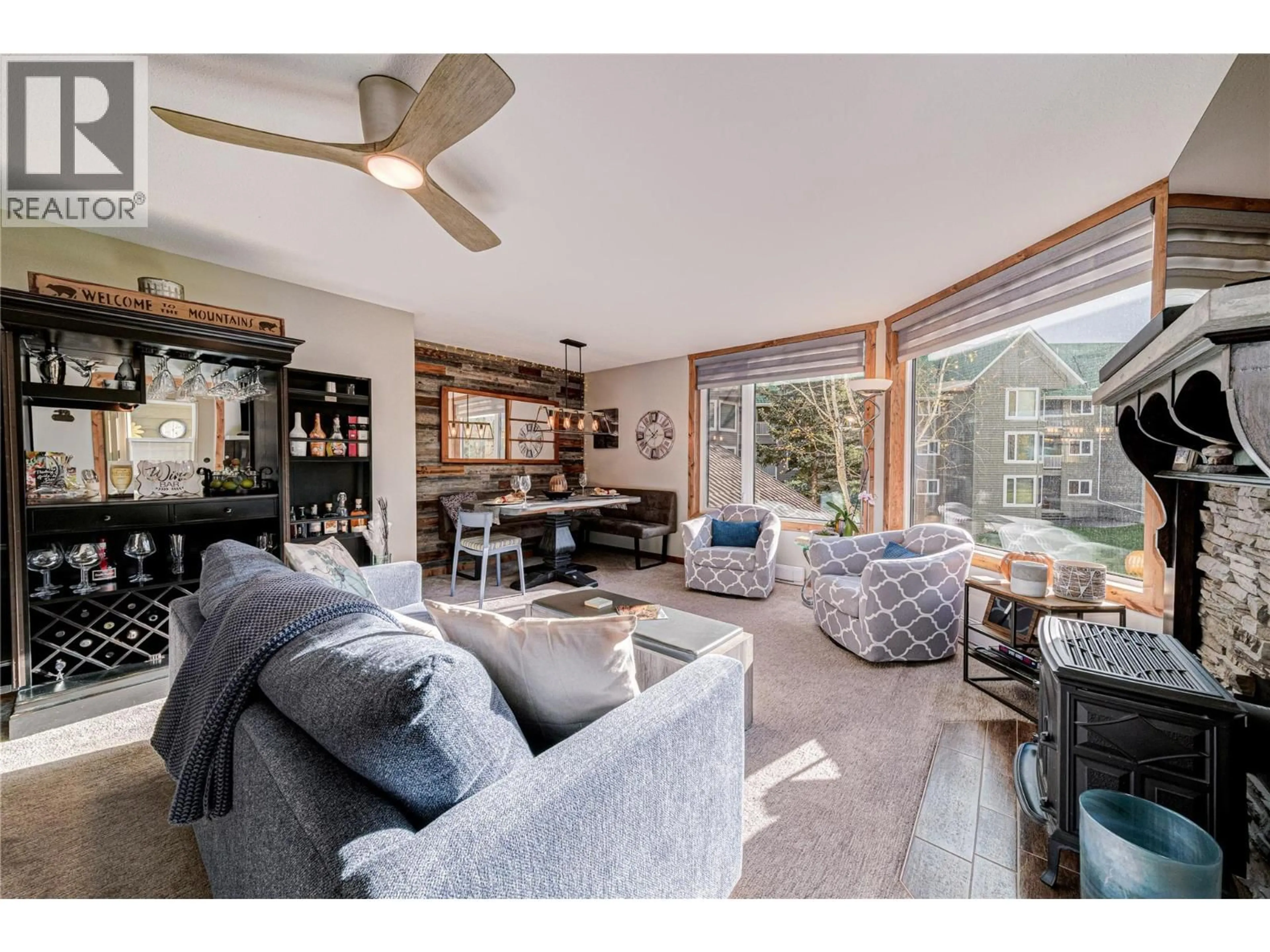 Living room with furniture, wood/laminate floor for 221 - 7559 TIMBERLINE CRESCENT, Fernie British Columbia V0B1M6