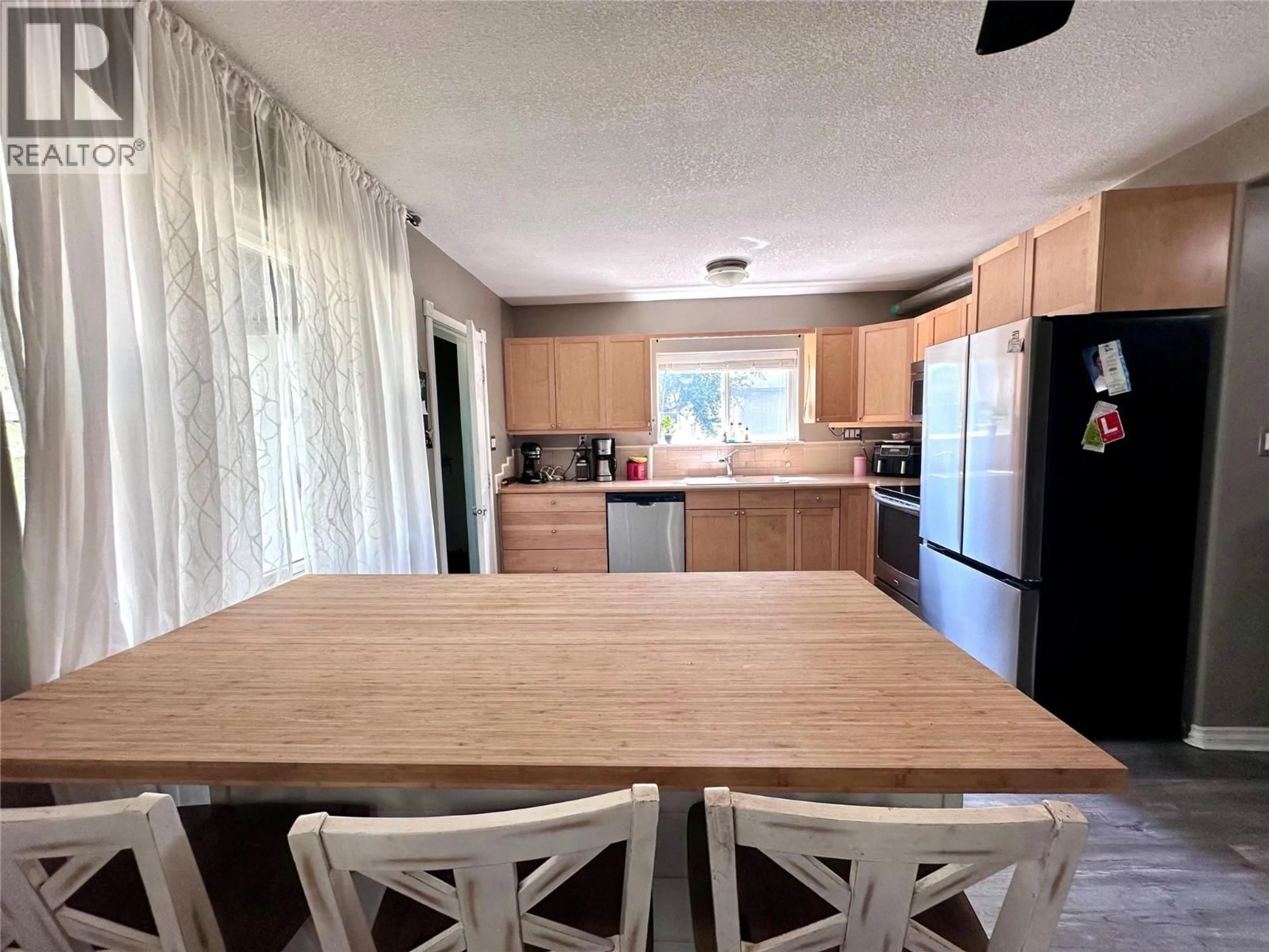 Open concept kitchen, wood/laminate floor for 411 7TH AVENUE, Castlegar British Columbia V1N1R1