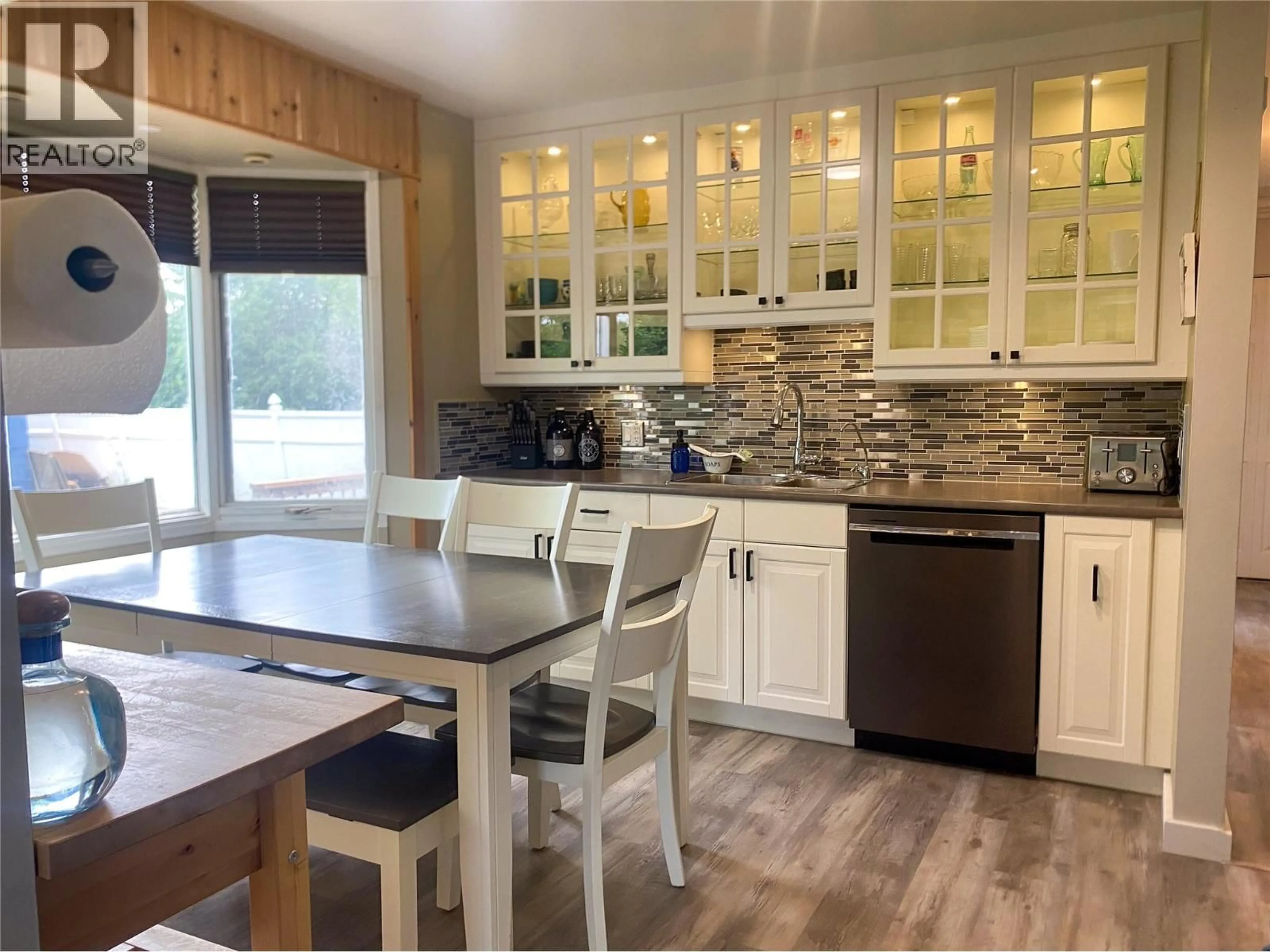 Open concept kitchen, wood/laminate floor for 849 111 AVENUE, Dawson Creek British Columbia V1G2X1