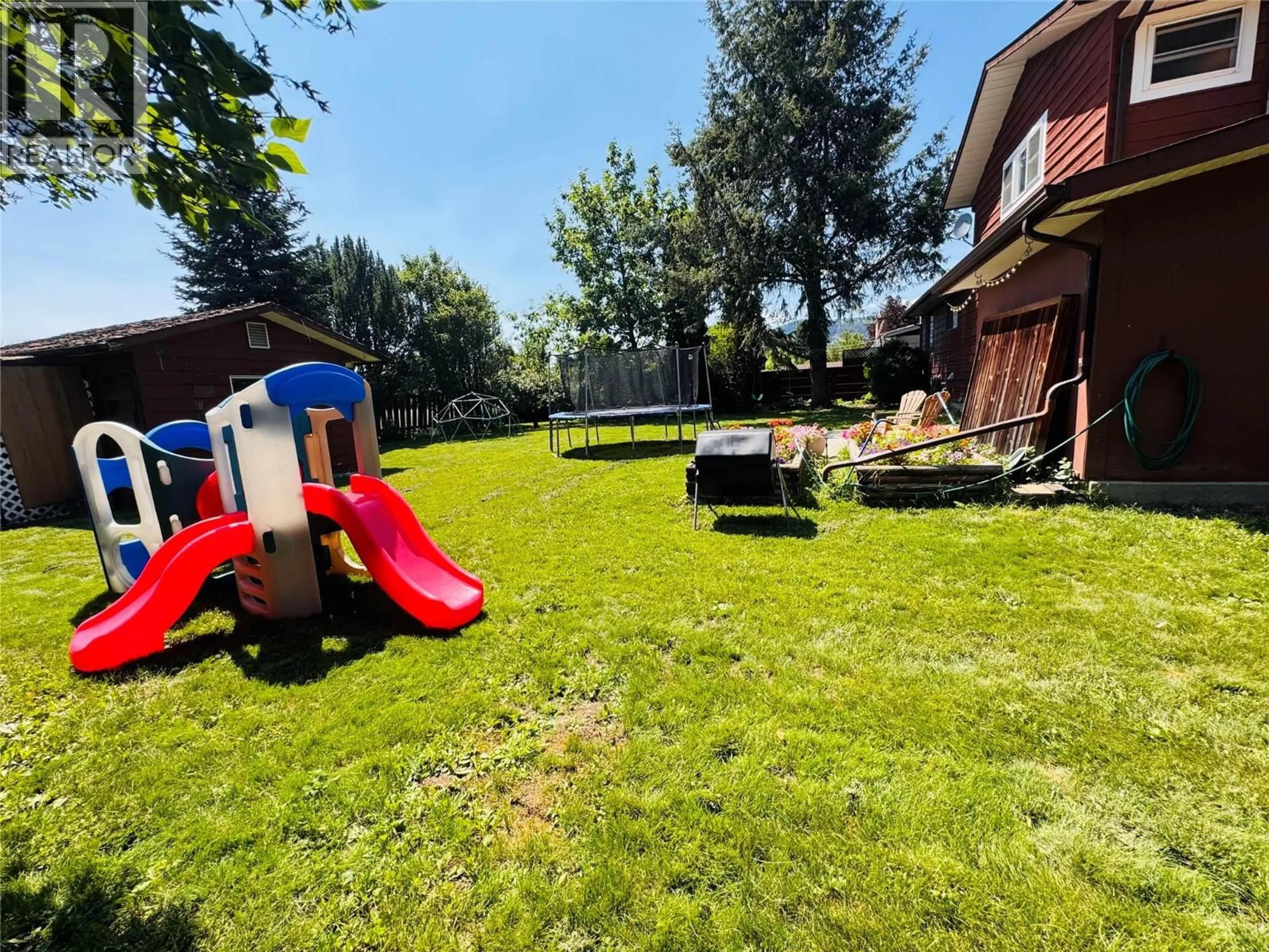 A pic from outside/outdoor area/front of a property/back of a property/a pic from drone, unknown for 1524 77TH AVENUE, Grand Forks British Columbia V0H1H0