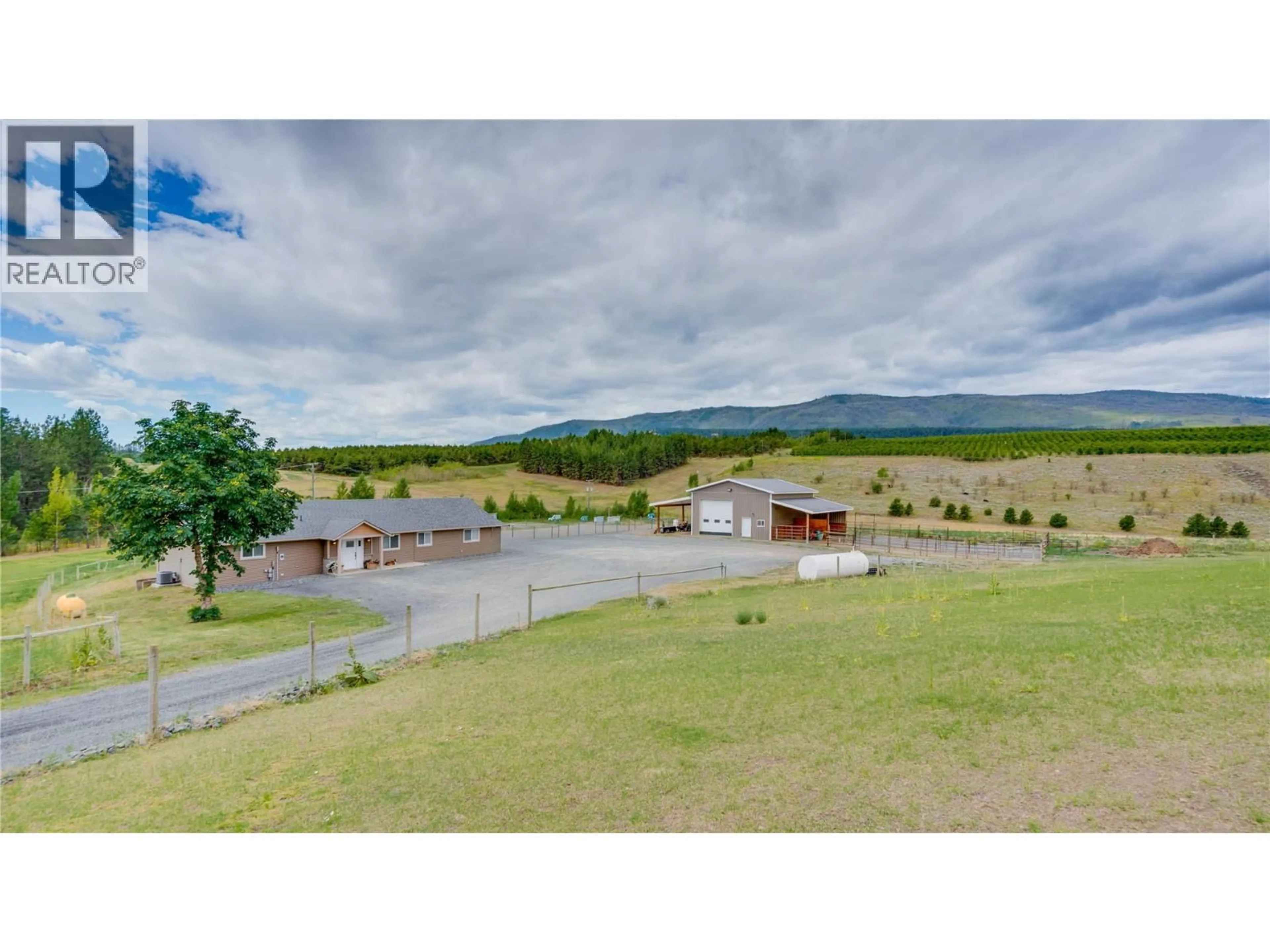 A pic from outside/outdoor area/front of a property/back of a property/a pic from drone, mountain view for 893 EVANS ROAD, Spallumcheen British Columbia V4Y0P6