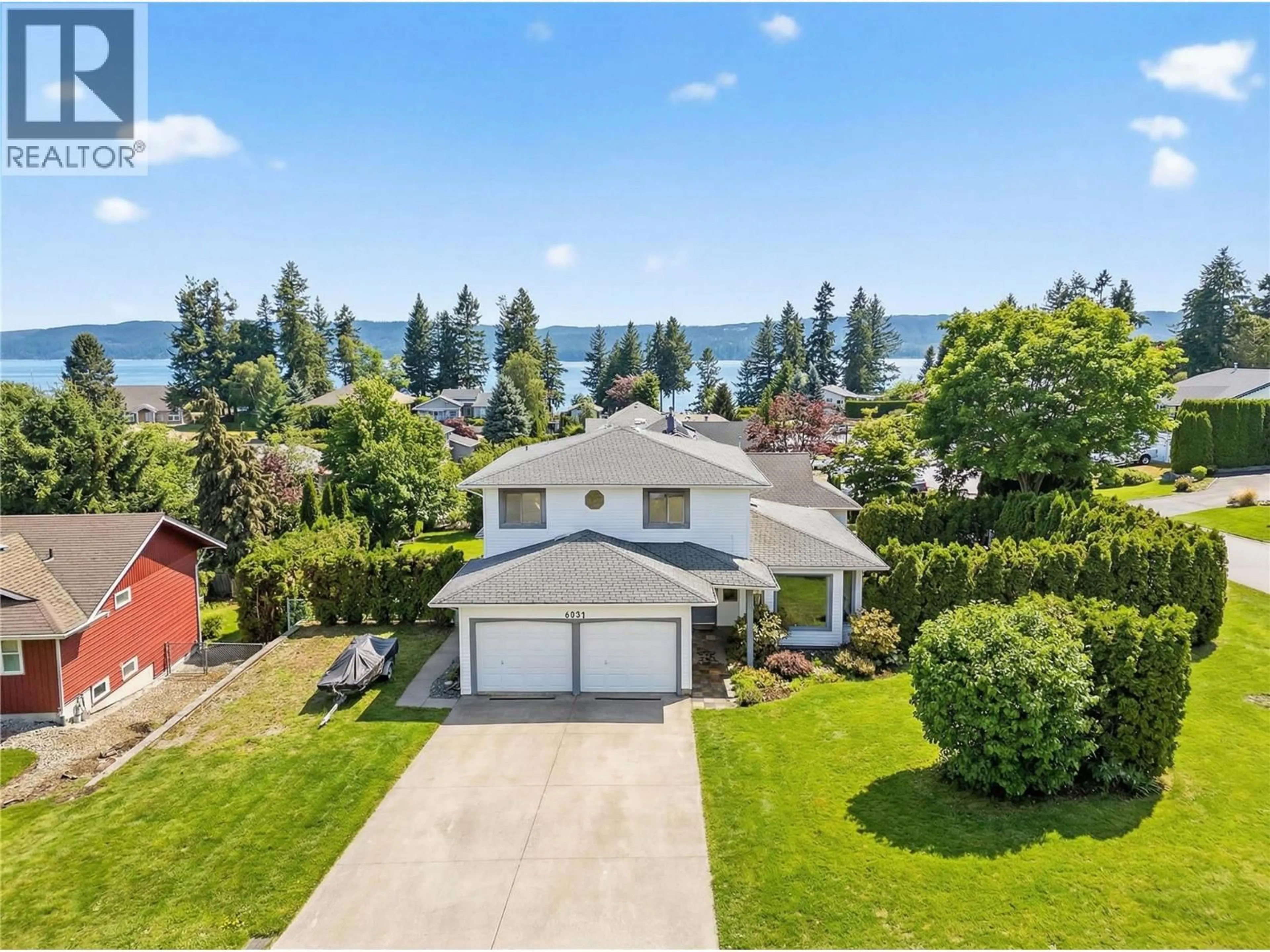 A pic from outside/outdoor area/front of a property/back of a property/a pic from drone, water/lake/river/ocean view for 4851 13 STREET NORTHEAST, Salmon Arm British Columbia V1E3P1