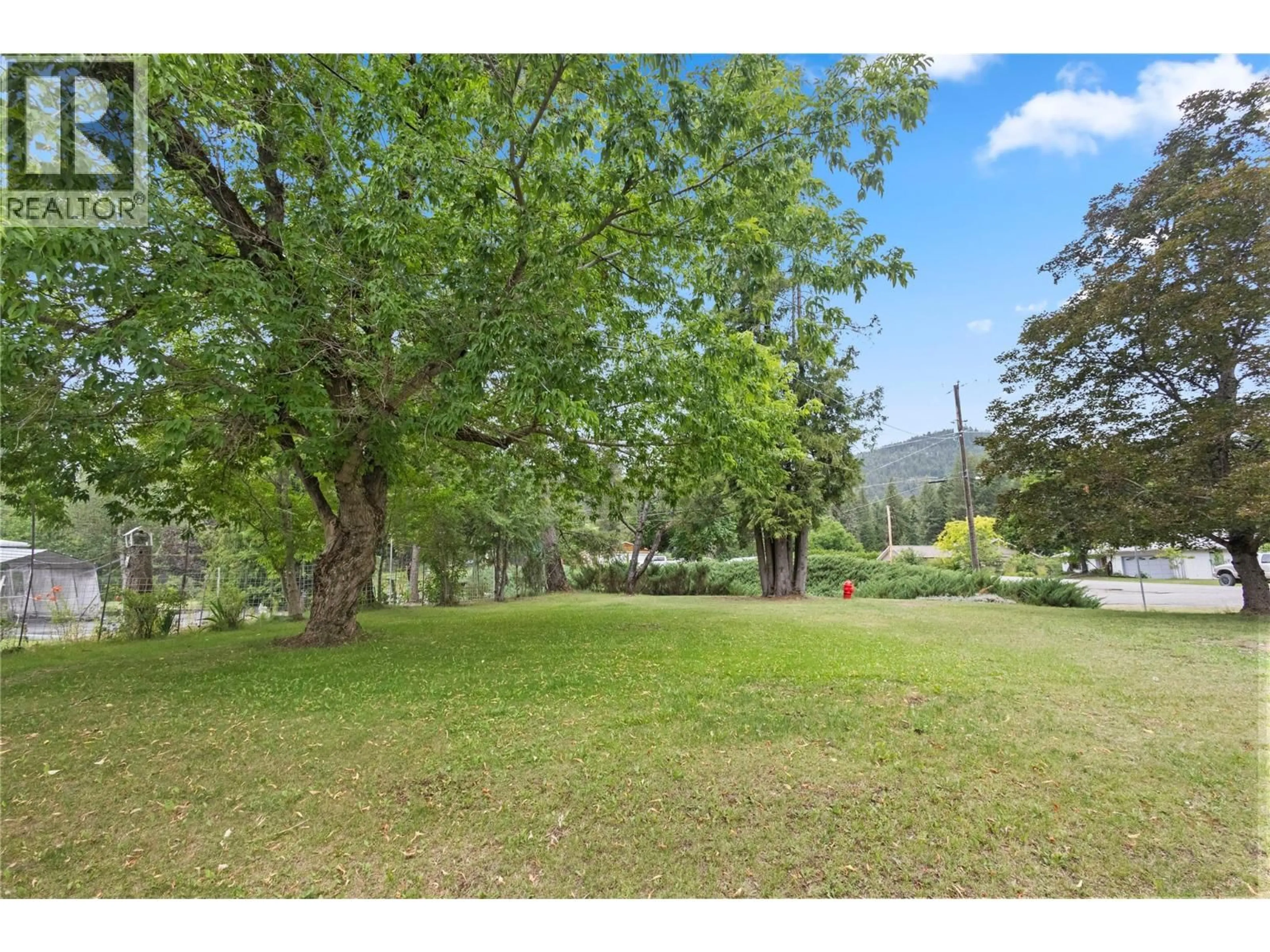 A pic from outside/outdoor area/front of a property/back of a property/a pic from drone, forest/trees view for 1538 BURGER ROAD, Christina Lake British Columbia V0H1E0