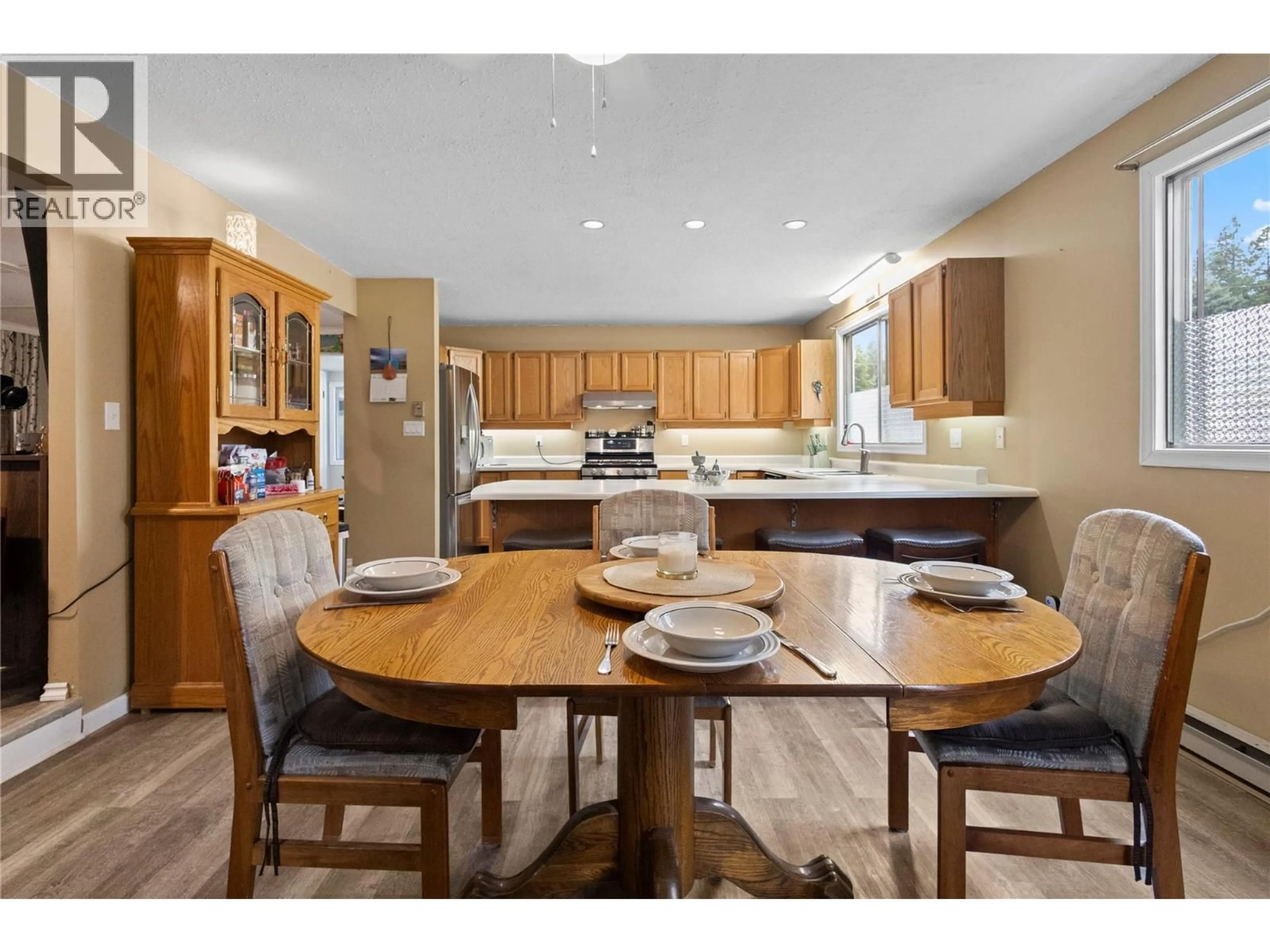 Open concept kitchen, wood/laminate floor for 1538 BURGER ROAD, Christina Lake British Columbia V0H1E0