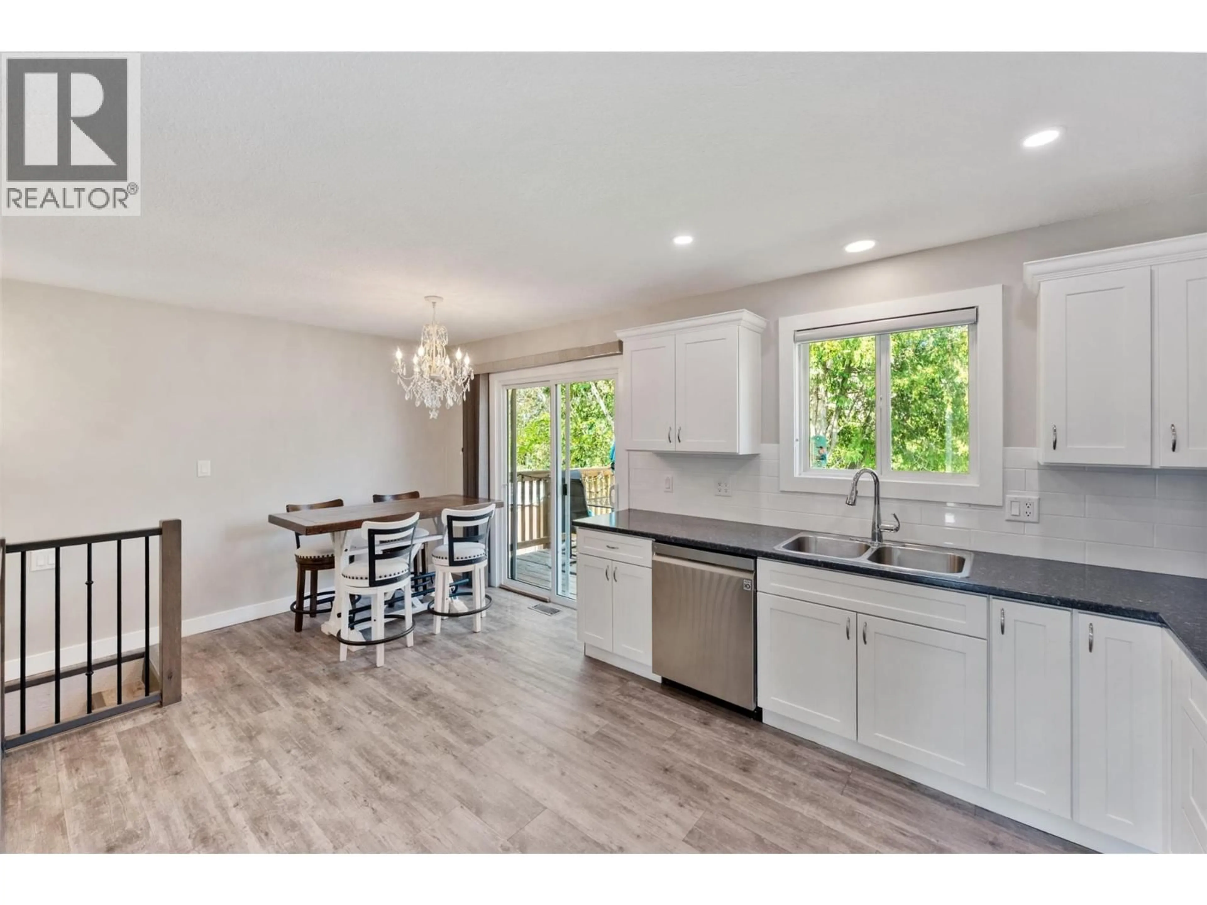 Open concept kitchen, wood/laminate floor for 5852 FAIRVIEW PLACE, Oliver British Columbia V0H1T1