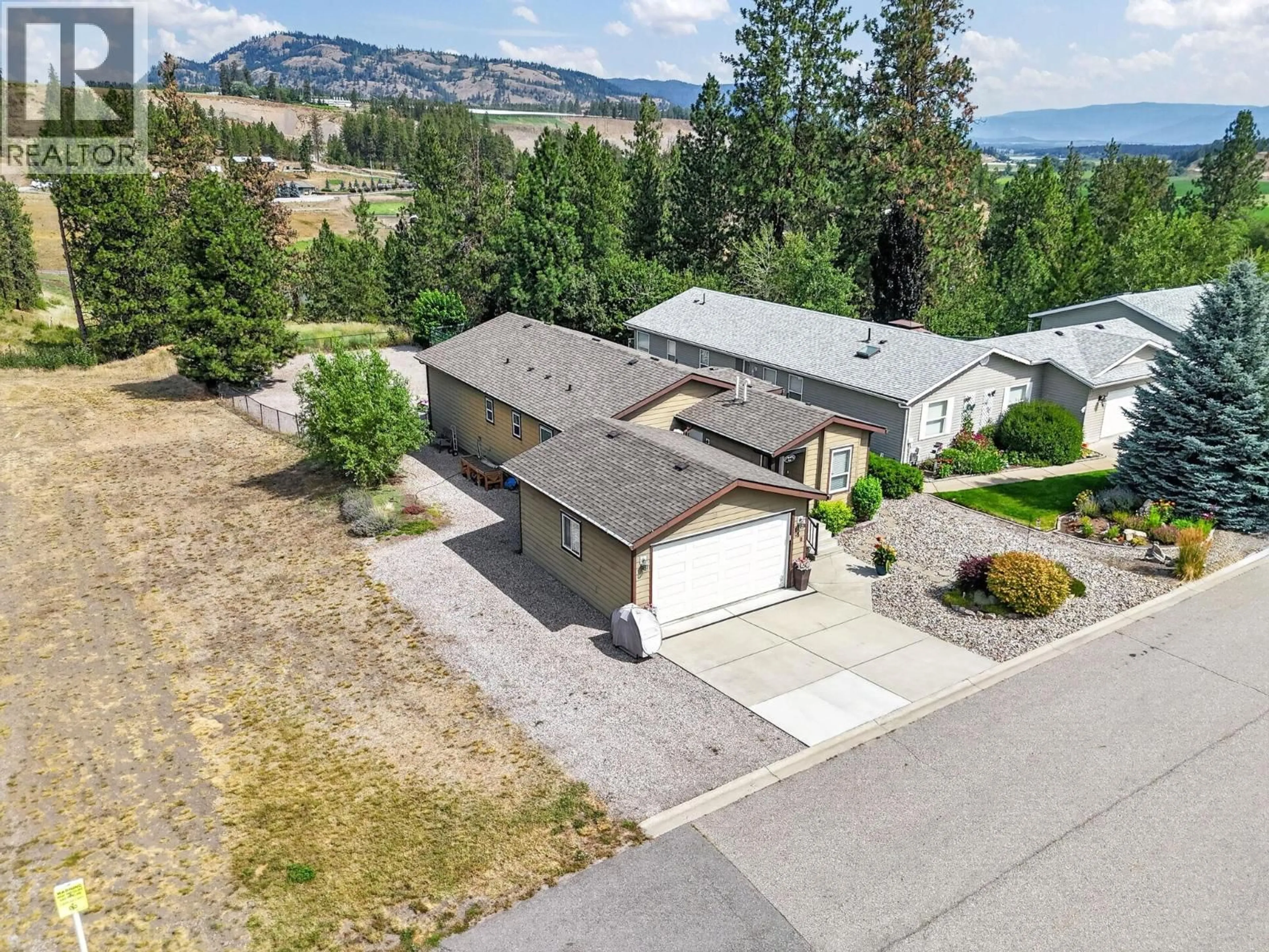 A pic from outside/outdoor area/front of a property/back of a property/a pic from drone, mountain view for 130 - 9510 97 HIGHWAY NORTH, Vernon British Columbia V1H1R8