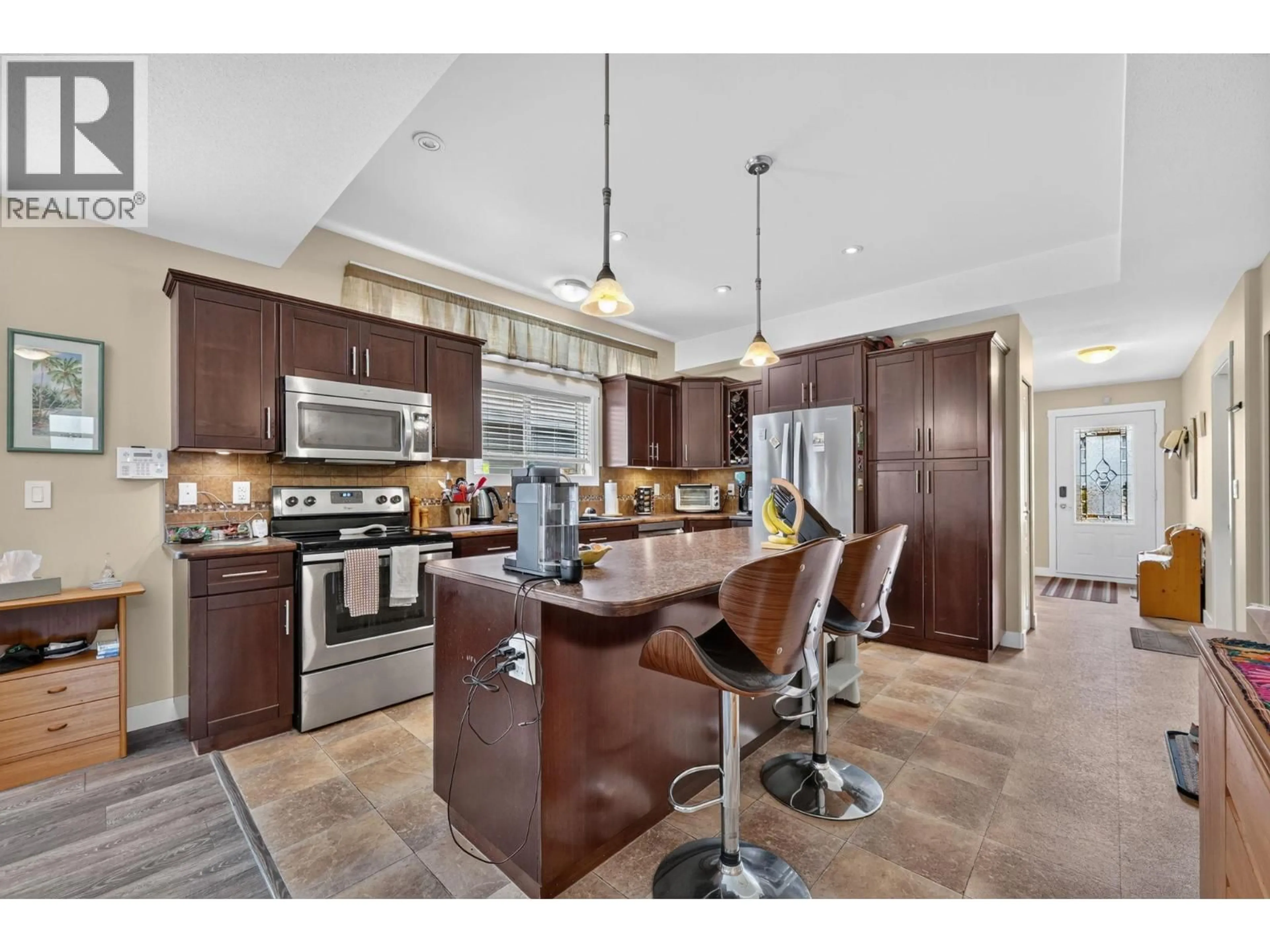 Open concept kitchen, ceramic/tile floor for 130 - 9510 97 HIGHWAY NORTH, Vernon British Columbia V1H1R8