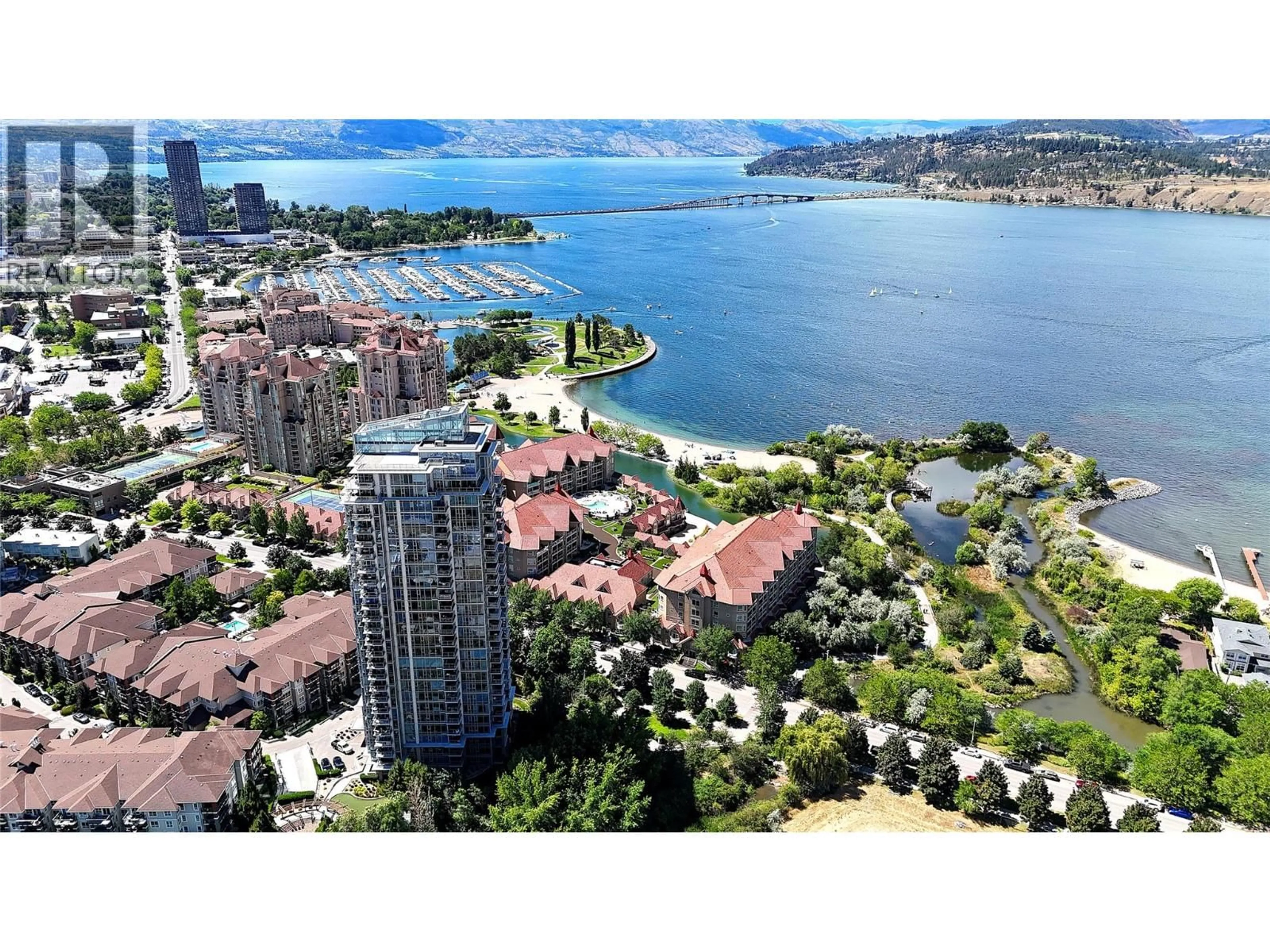 A pic from outside/outdoor area/front of a property/back of a property/a pic from drone, water/lake/river/ocean view for 2308 - 1075 SUNSET DRIVE, Kelowna British Columbia V1Y9Y9