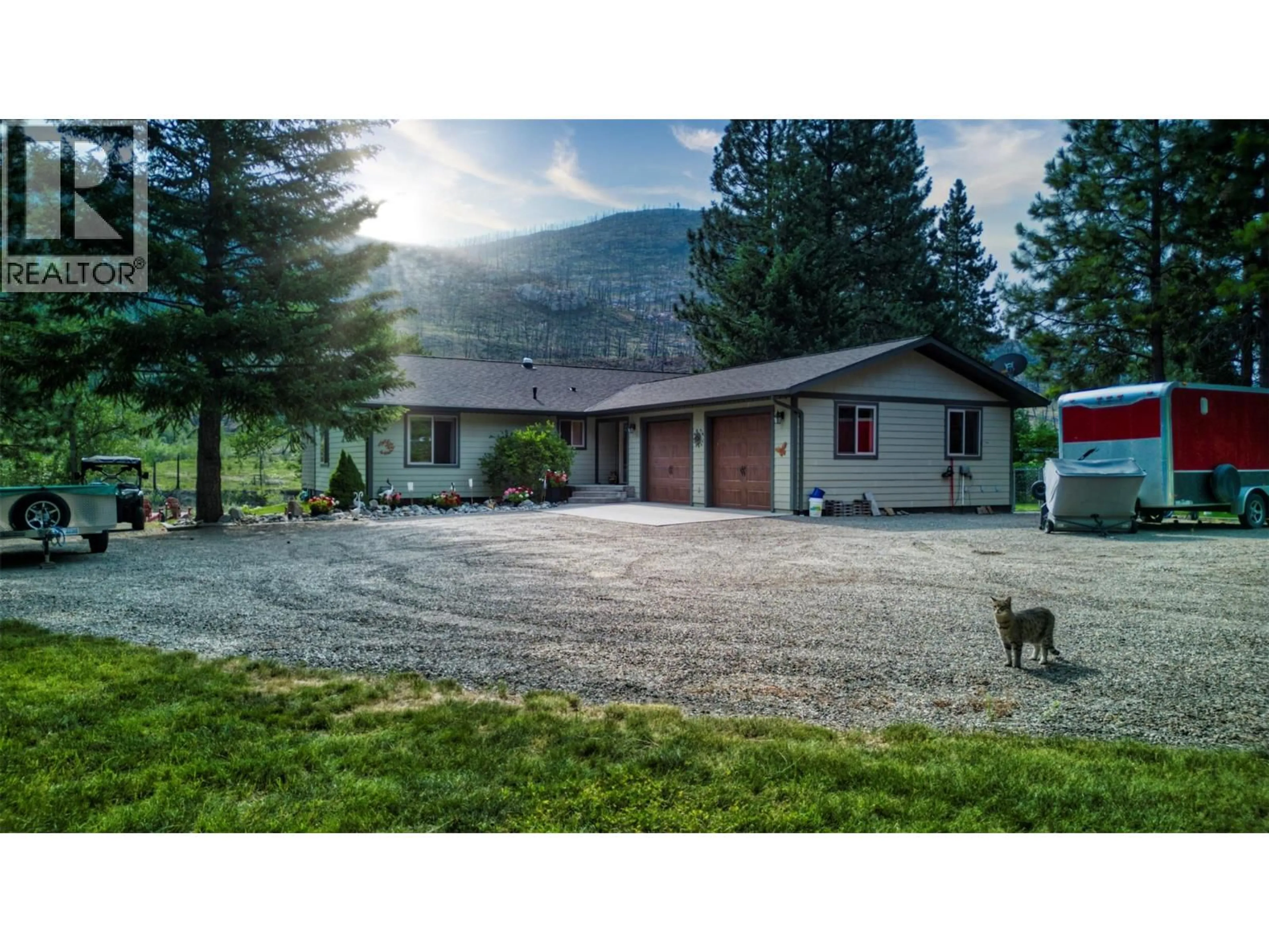 A pic from outside/outdoor area/front of a property/back of a property/a pic from drone, mountain view for 212 VINTAGE LANE, Rock Creek British Columbia V0H1Y0
