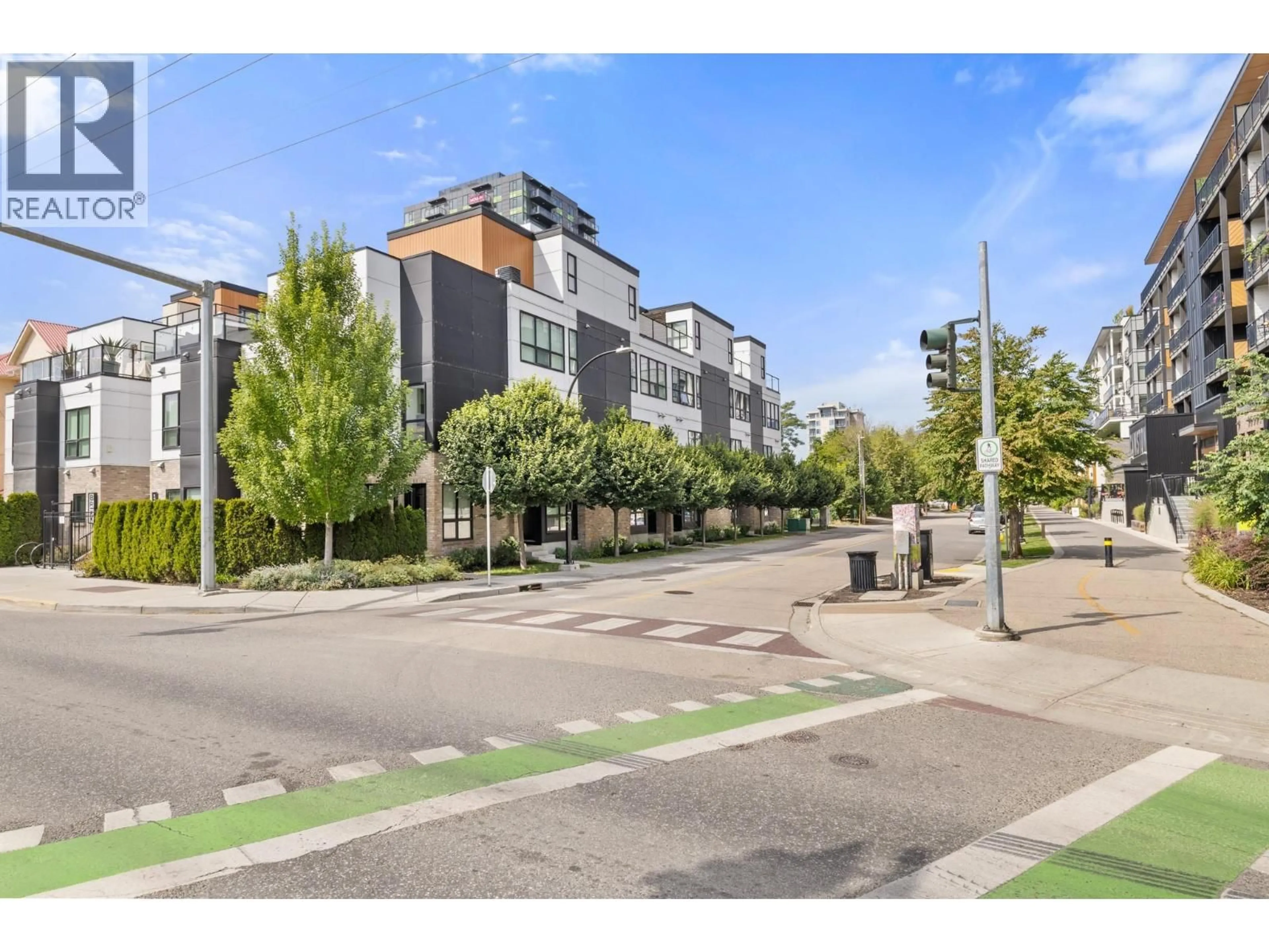 A pic from outside/outdoor area/front of a property/back of a property/a pic from drone, street for 102 - 1308 RICHTER STREET, Kelowna British Columbia V1Y2L3
