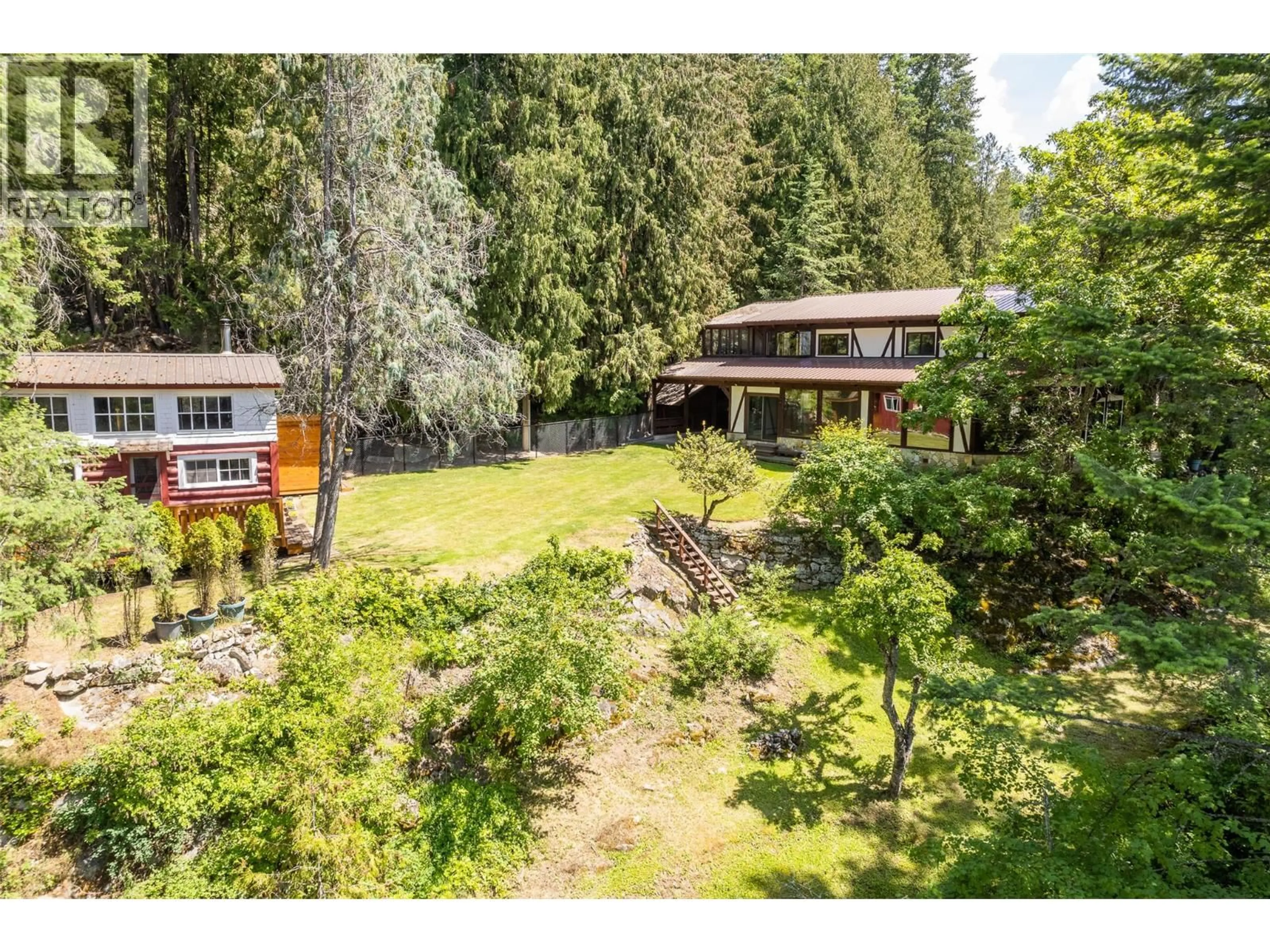 A pic from outside/outdoor area/front of a property/back of a property/a pic from drone, unknown for 10208 TWIN BAYS ROAD, Creston British Columbia V0B1A1