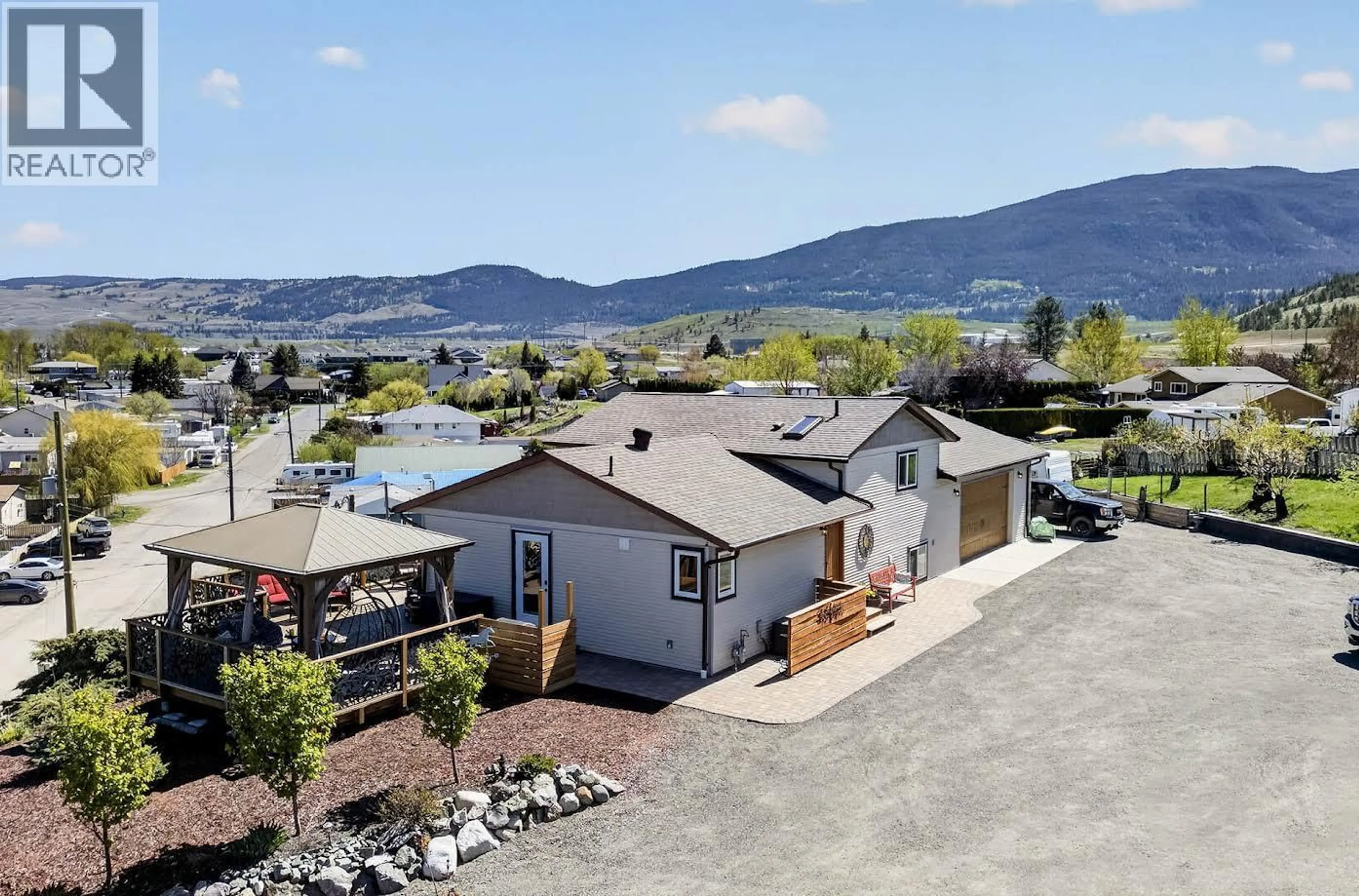A pic from outside/outdoor area/front of a property/back of a property/a pic from drone, mountain view for 1301 FIR AVENUE, Merritt British Columbia V1S1L1