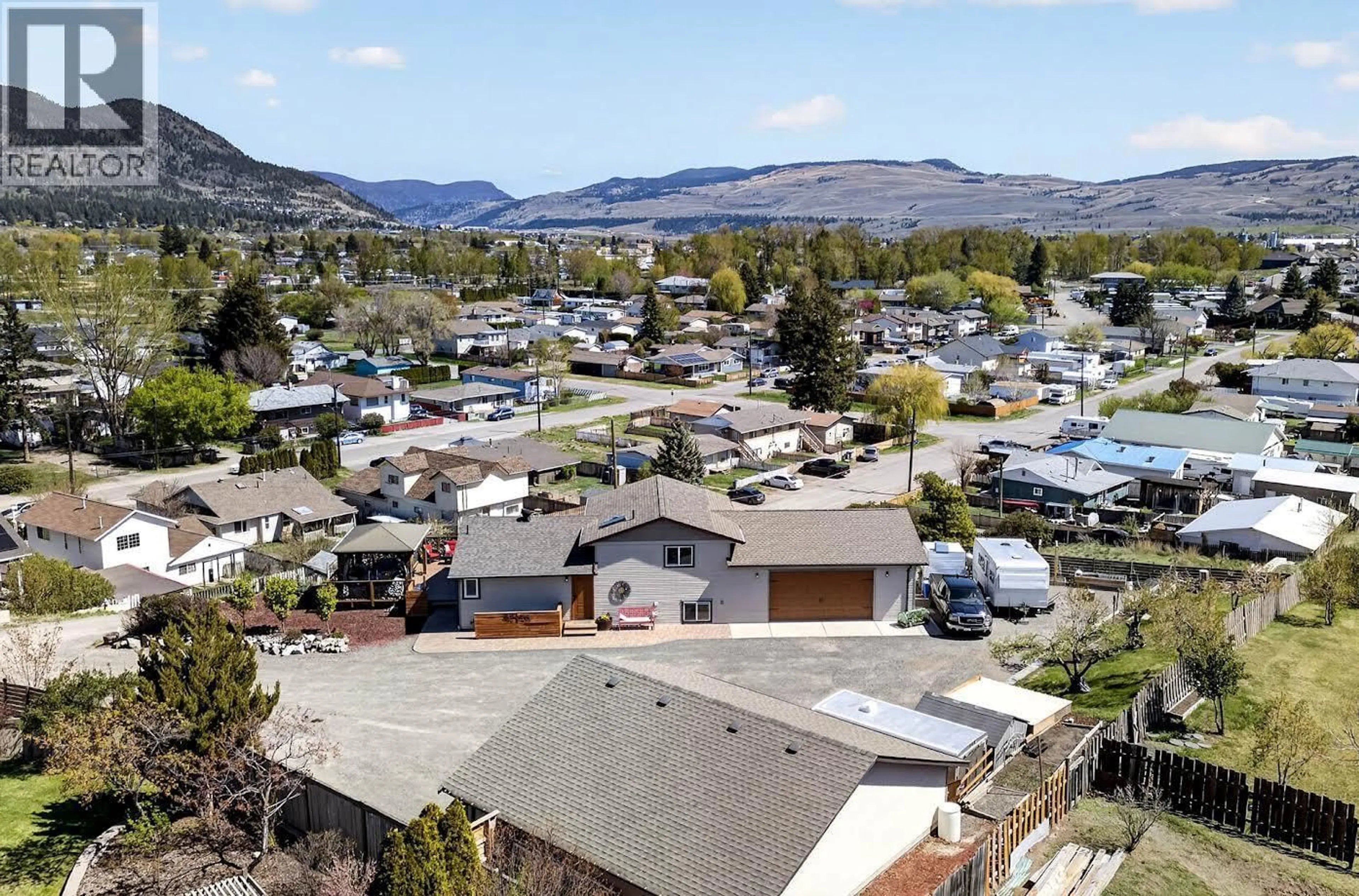 A pic from outside/outdoor area/front of a property/back of a property/a pic from drone, mountain view for 1301 FIR AVENUE, Merritt British Columbia V1S1L1