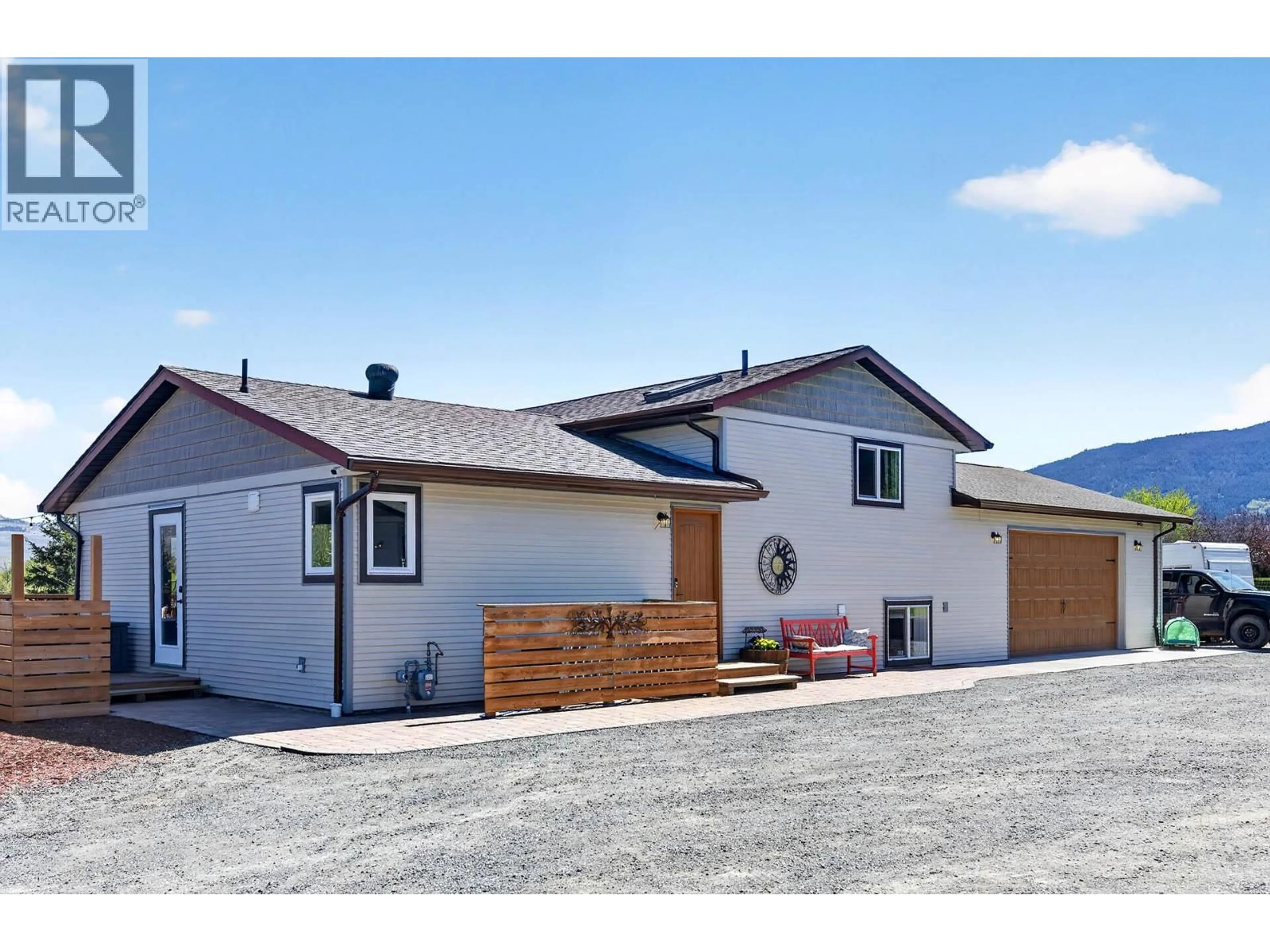 Home with vinyl exterior material, mountain view for 1301 FIR AVENUE, Merritt British Columbia V1S1L1