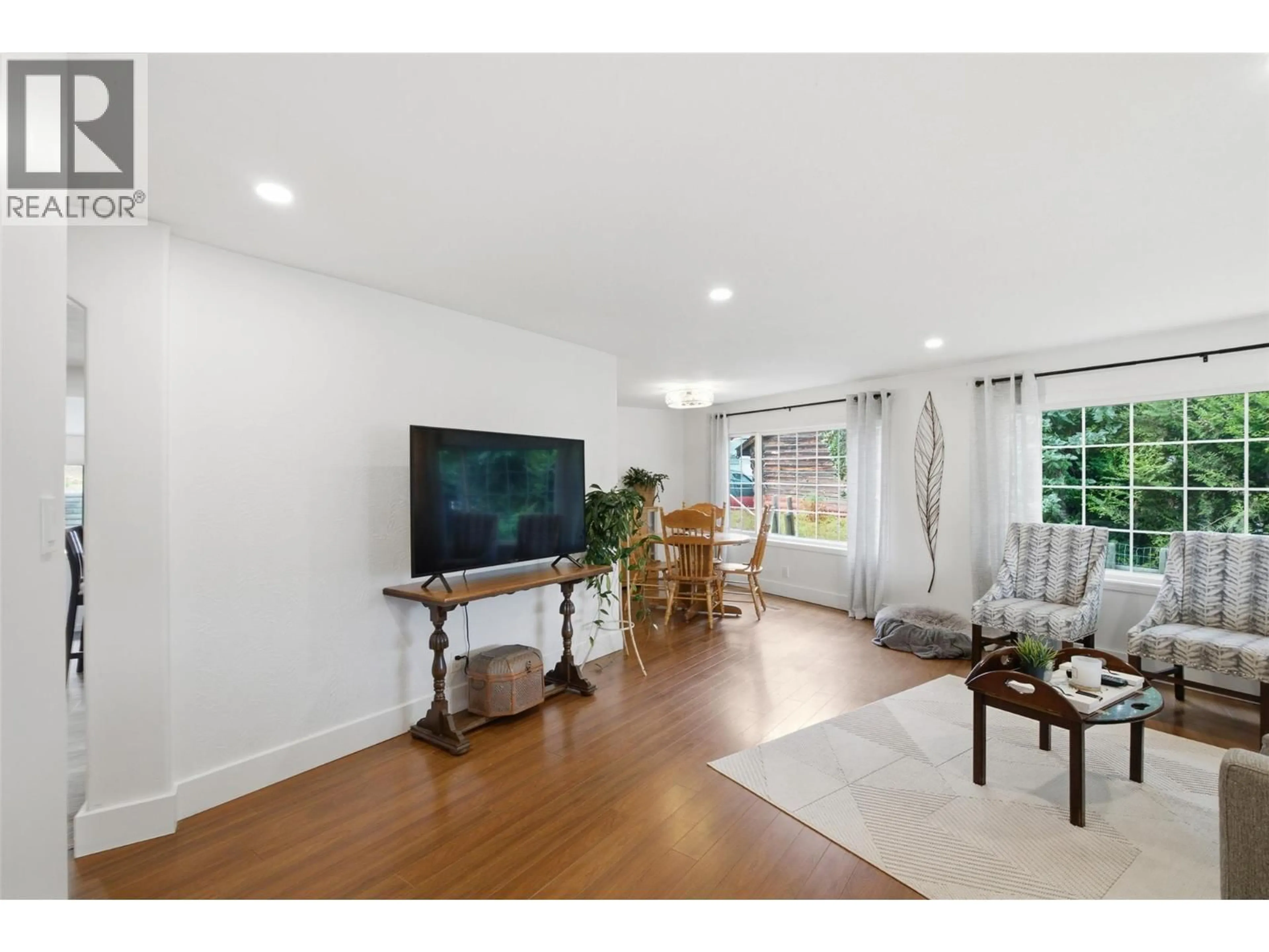 Living room with furniture, wood/laminate floor for 4873 GERELLA ROAD, Kamloops British Columbia V0E2P0