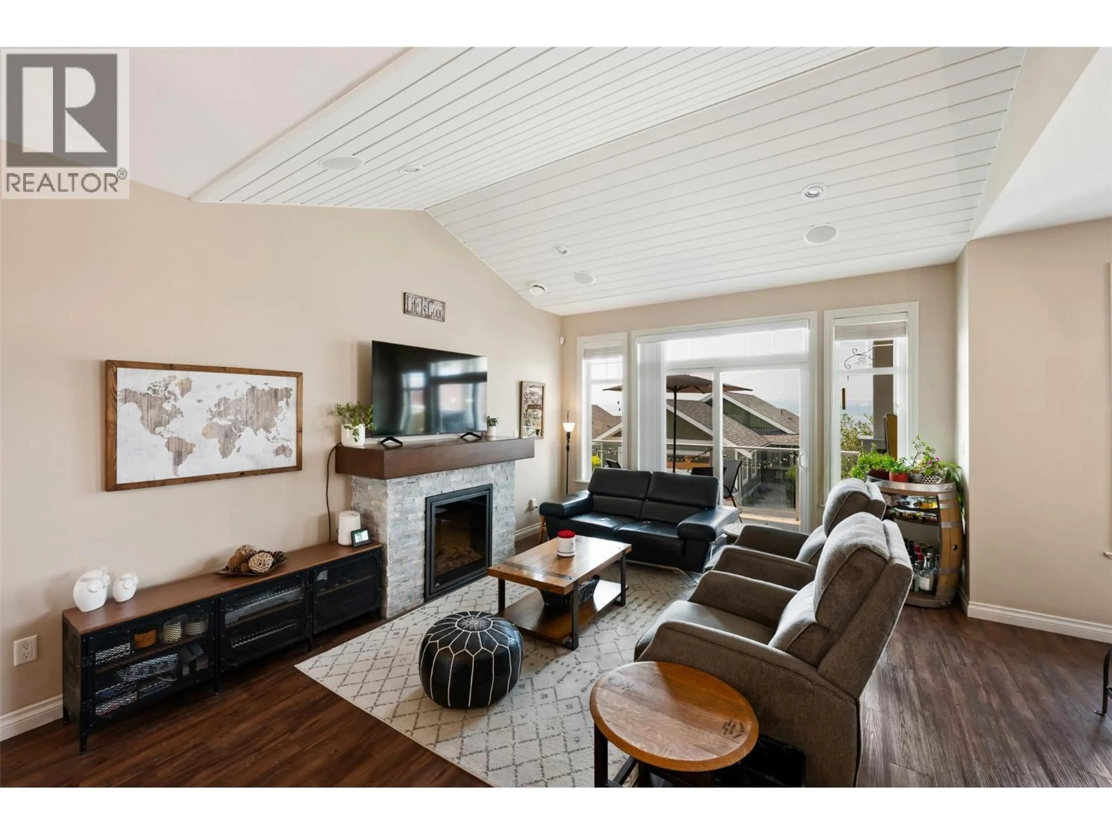 Living room with furniture, wood/laminate floor for 228 - 2450 RADIO TOWER ROAD, Oliver British Columbia V0H1T1
