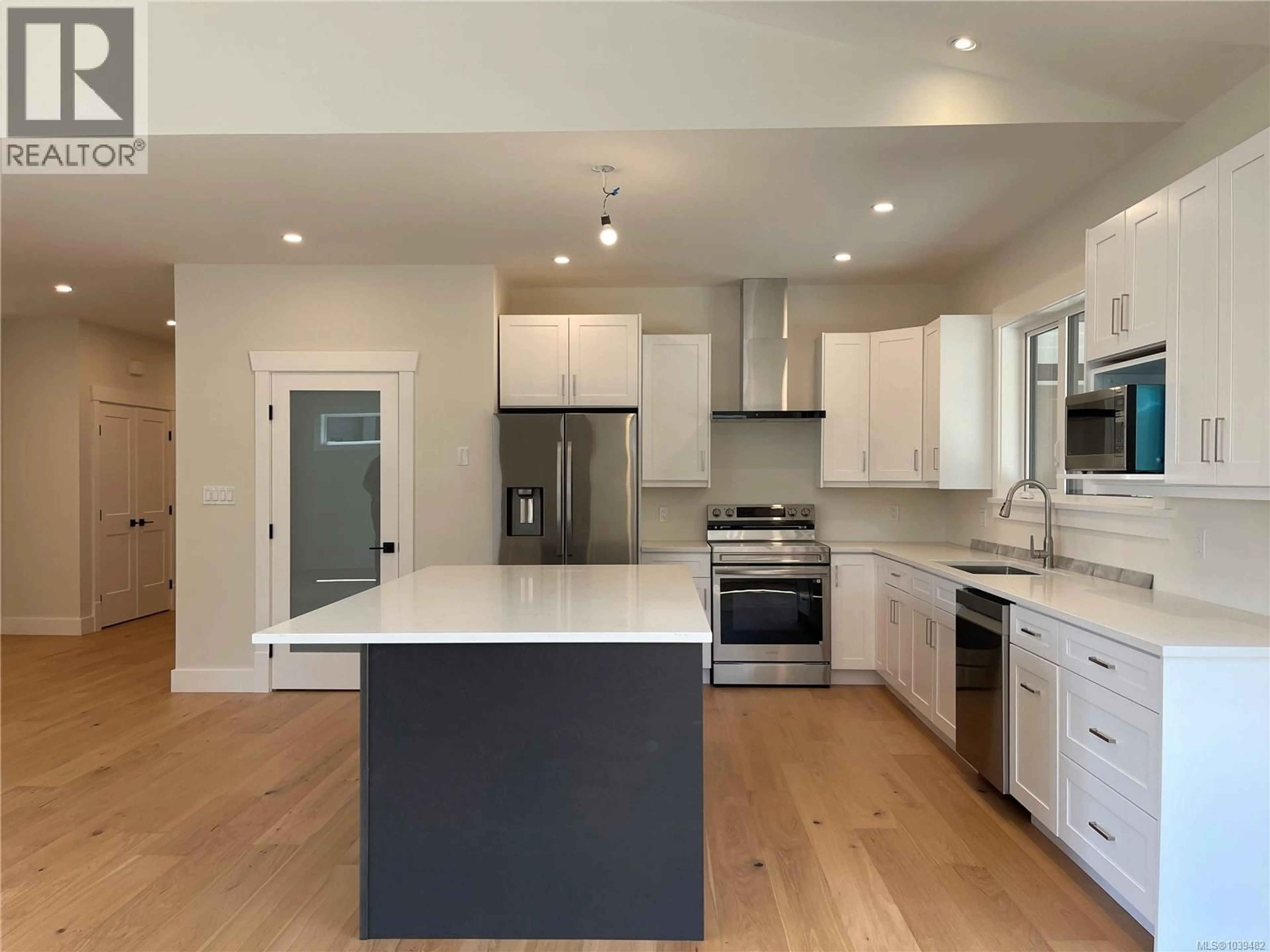 Open concept kitchen, wood/laminate floor for 3036 ARBUTUS DRIVE, Port Alberni British Columbia V9Y0C4