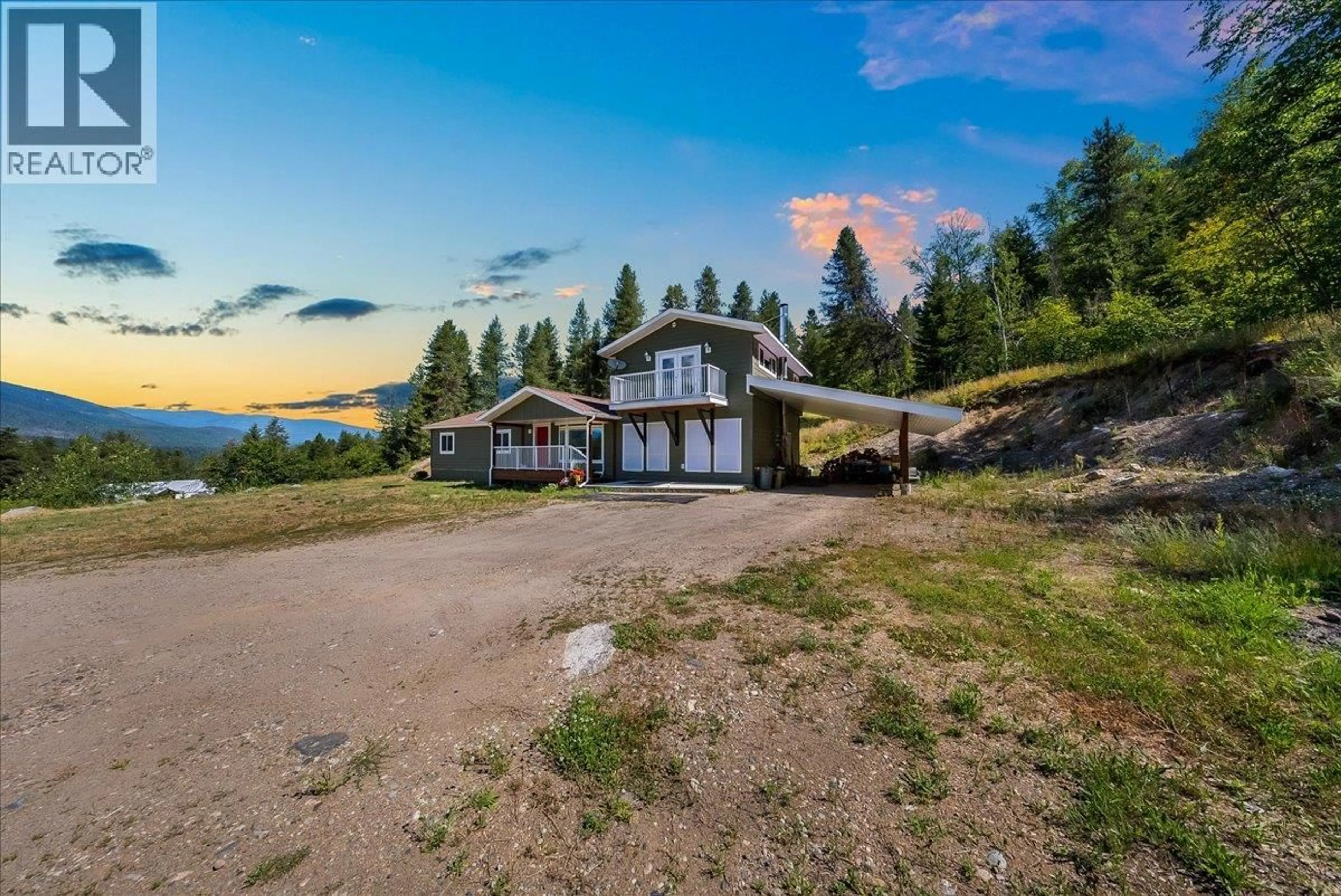 A pic from outside/outdoor area/front of a property/back of a property/a pic from drone, mountain view for 591 BAERG ROAD, Castlegar British Columbia V1N4K6