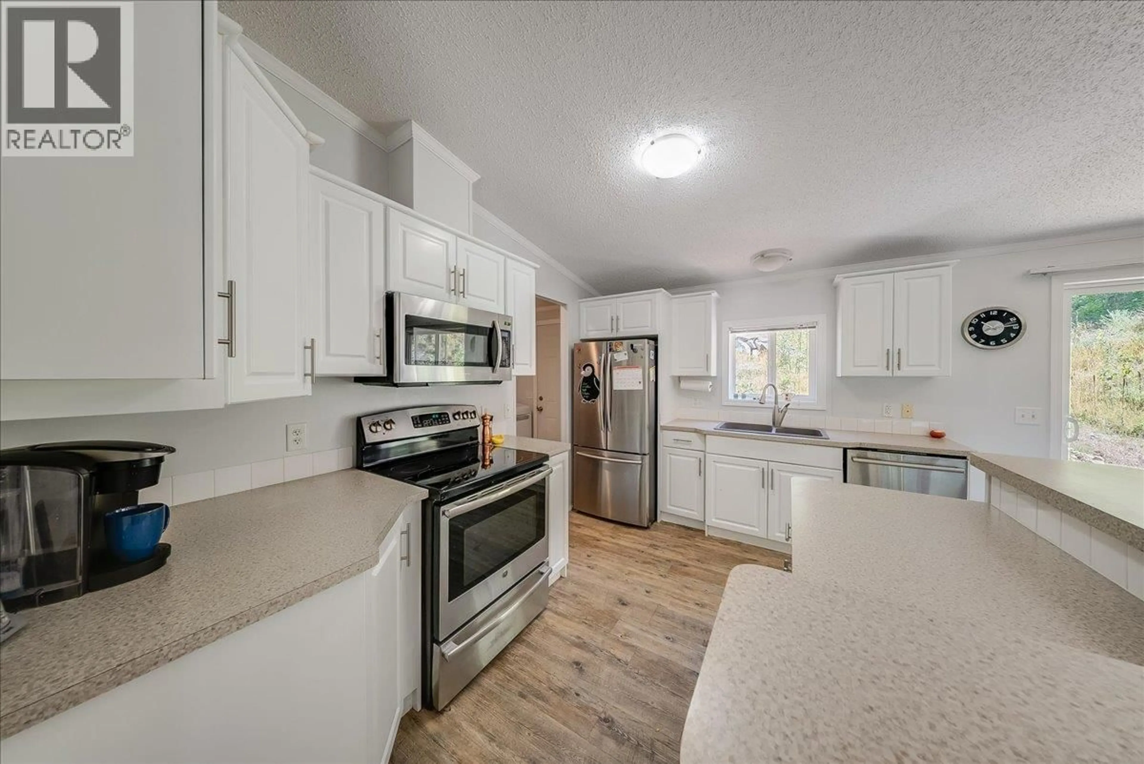 Open concept kitchen, ceramic/tile floor for 591 BAERG ROAD, Castlegar British Columbia V1N4K6