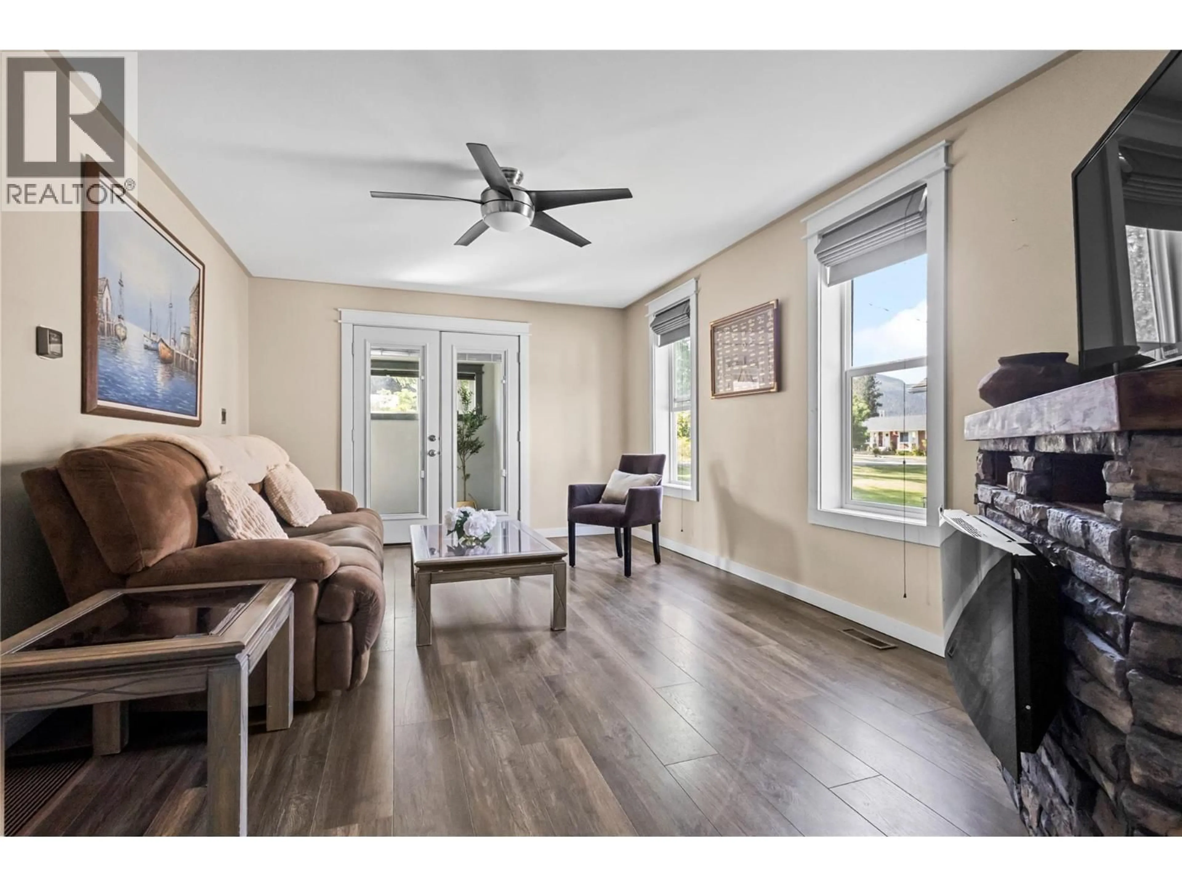 Living room with furniture, wood/laminate floor for 1640 ODE ROAD, Christina Lake British Columbia V0H1E0