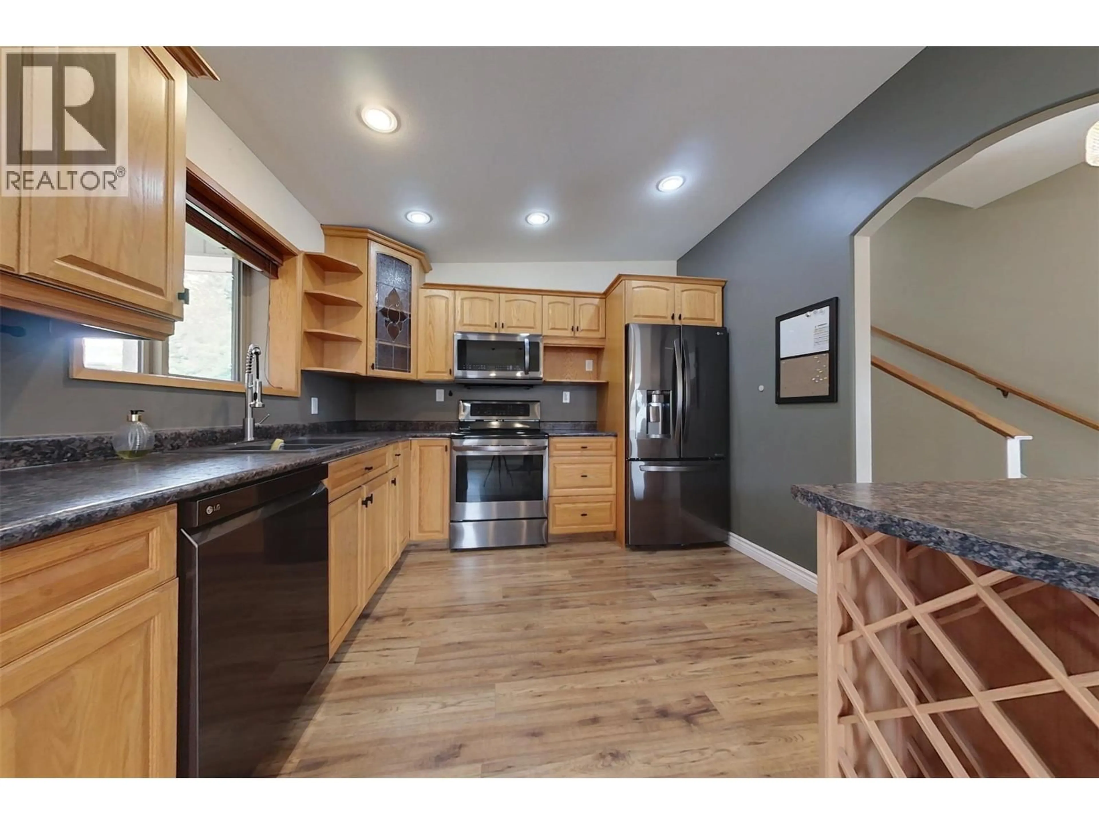 Open concept kitchen, wood/laminate floor for 1409 SOUTHVIEW DRIVE, Cranbrook British Columbia V1C6S1