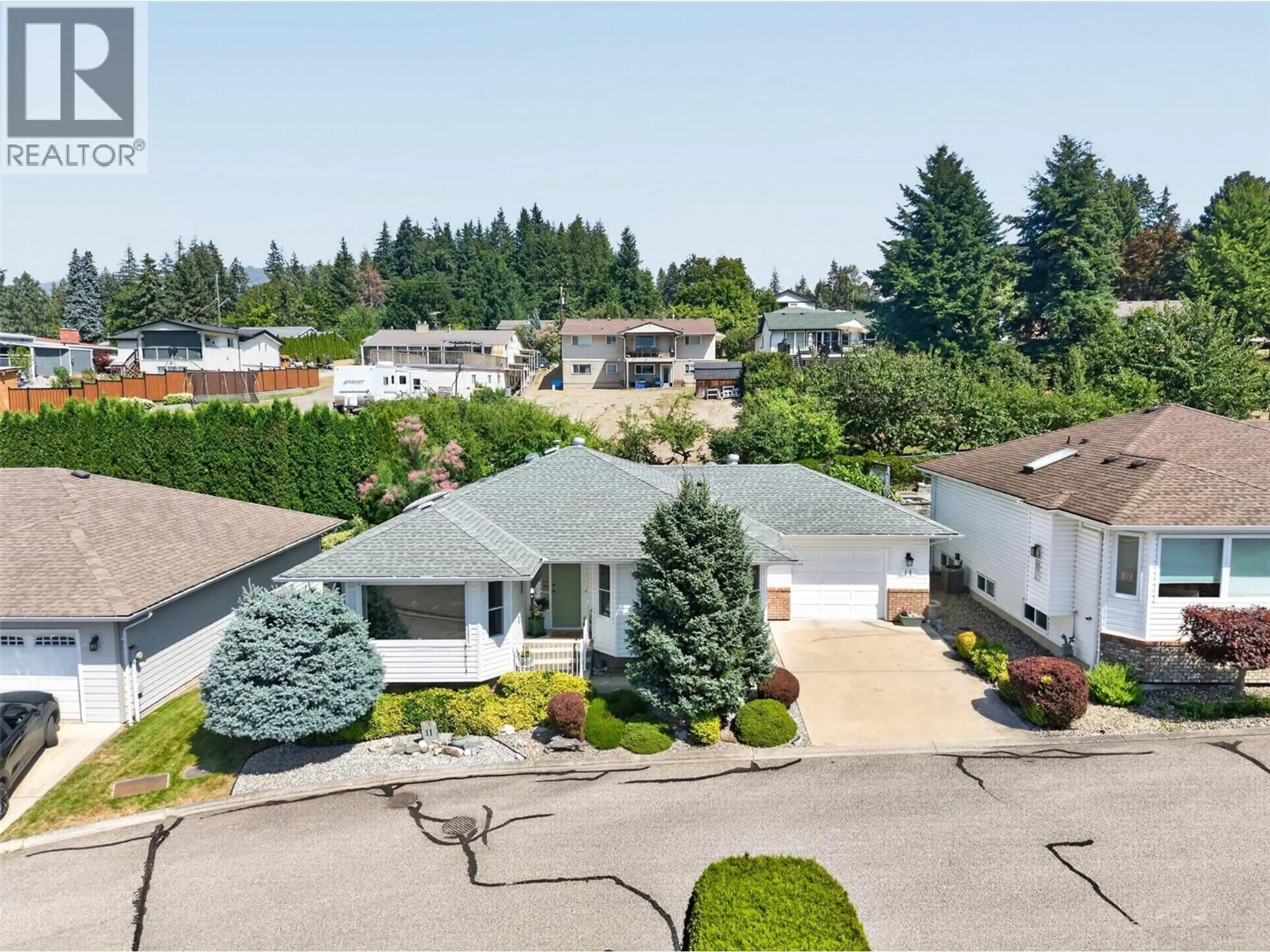 A pic from outside/outdoor area/front of a property/back of a property/a pic from drone, street for 11 - 1120 12 STREET NORTHEAST, Salmon Arm British Columbia V1E1B8