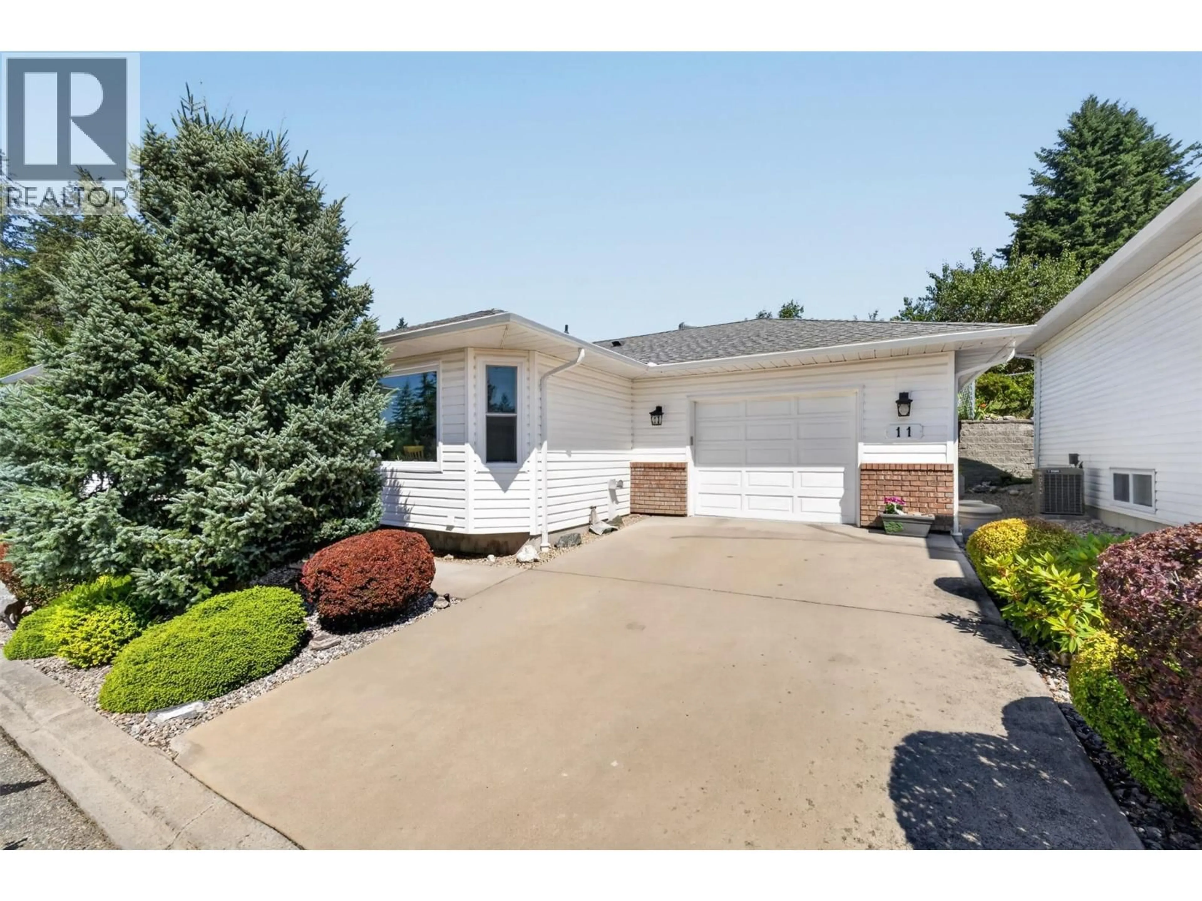 Home with vinyl exterior material, street for 11 - 1120 12 STREET NORTHEAST, Salmon Arm British Columbia V1E1B8