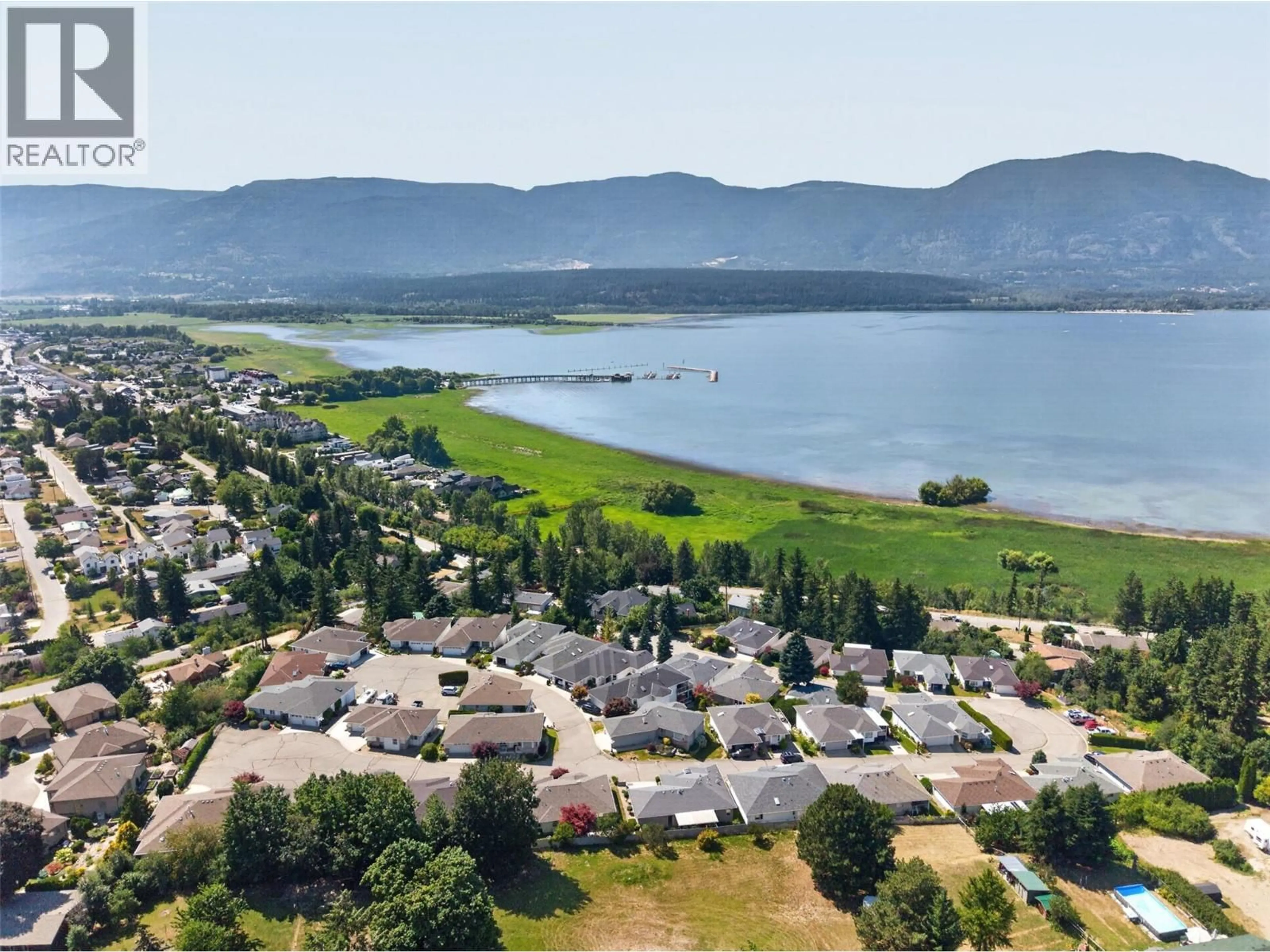 A pic from outside/outdoor area/front of a property/back of a property/a pic from drone, water/lake/river/ocean view for 11 - 1120 12 STREET NORTHEAST, Salmon Arm British Columbia V1E1B8