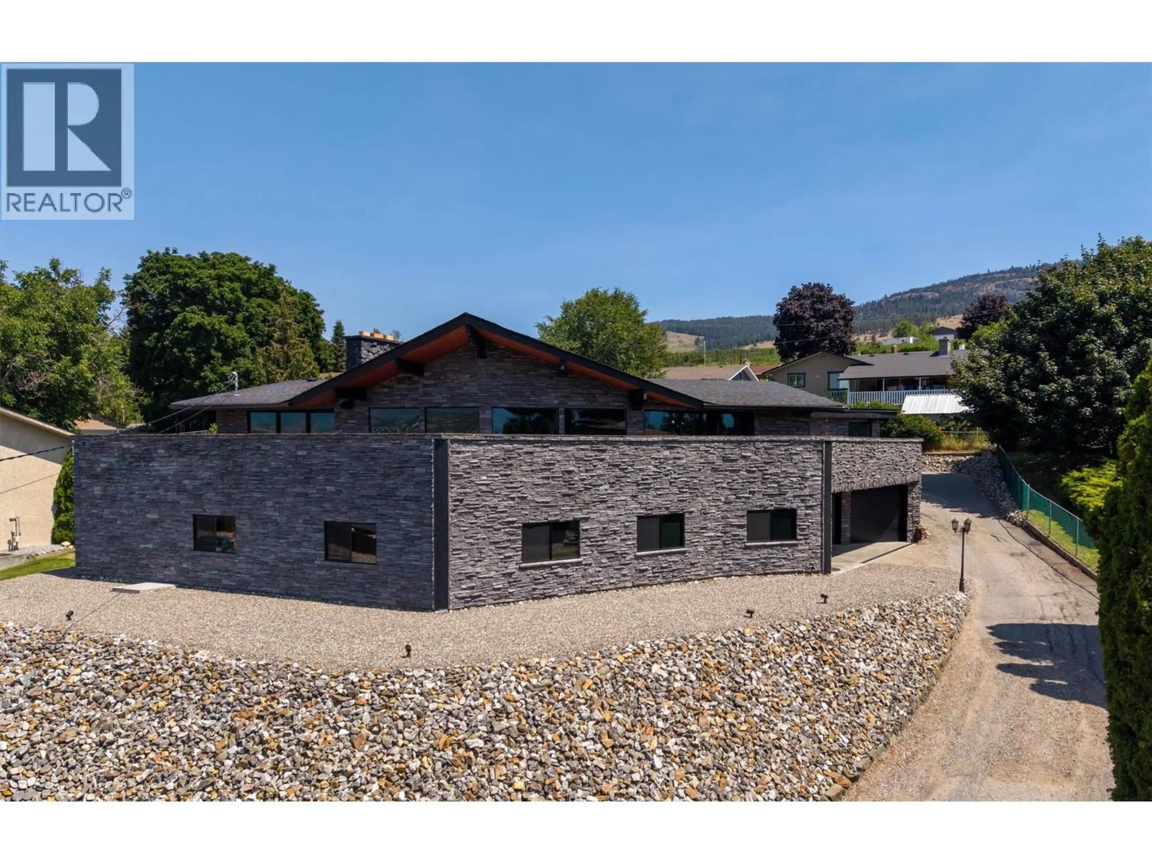 A pic from outside/outdoor area/front of a property/back of a property/a pic from drone, building for 1165 GIBSON ROAD, Kelowna British Columbia V1P1B7