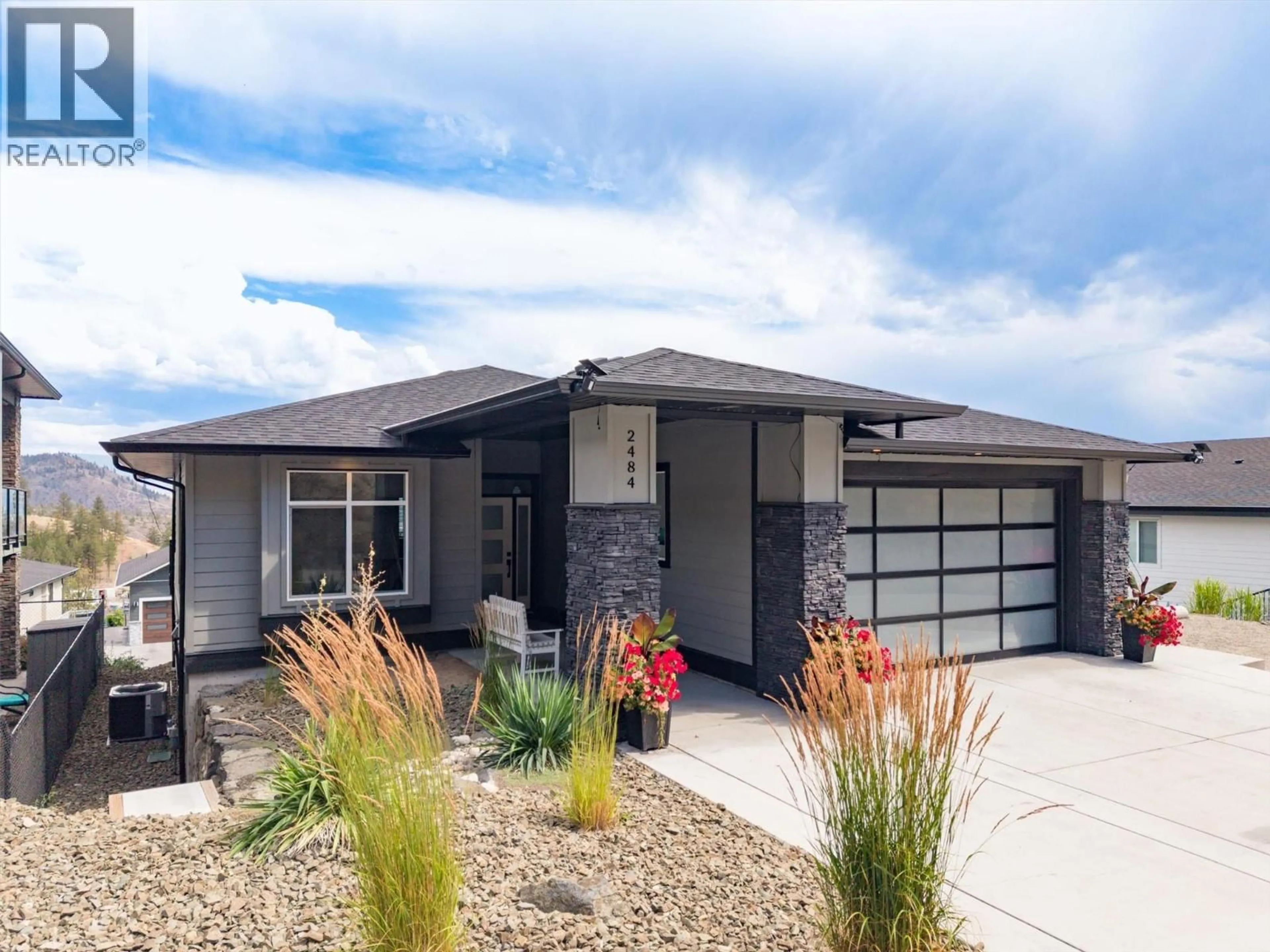 Home with brick exterior material, street for 2484 TALLUS HEIGHTS LANE, West Kelowna British Columbia V4T3M2