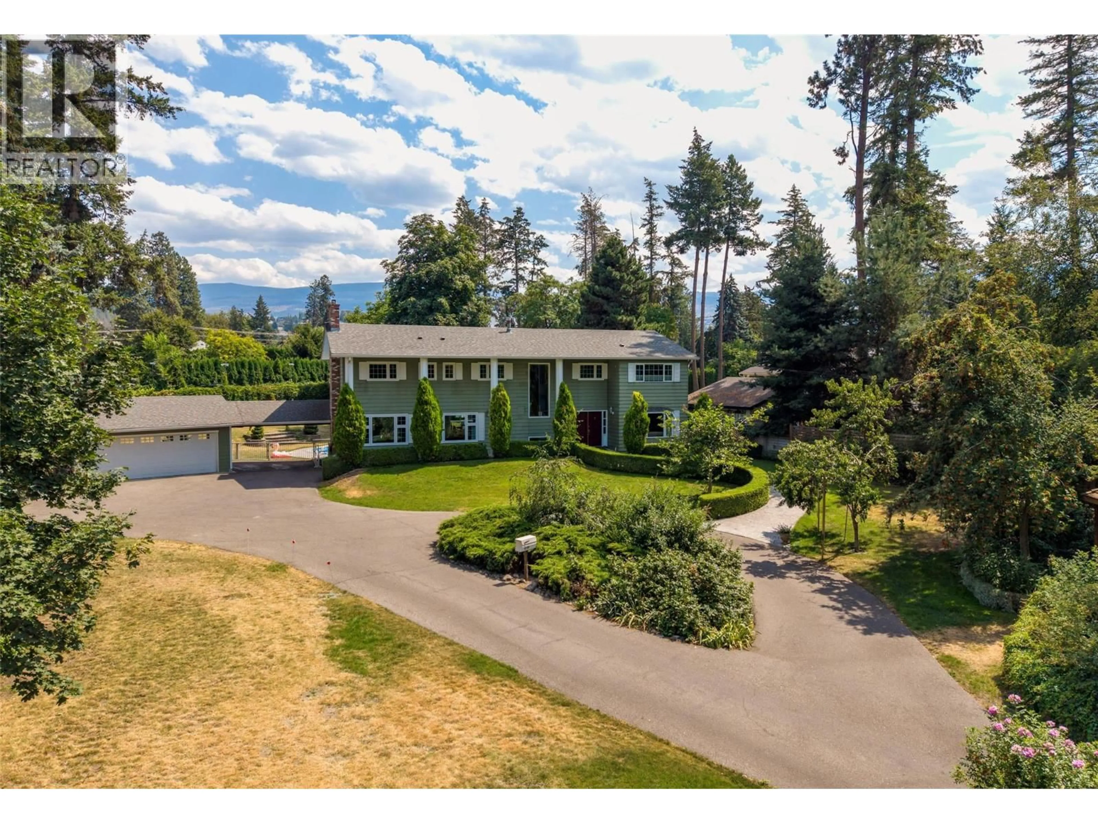 A pic from outside/outdoor area/front of a property/back of a property/a pic from drone, mountain view for 4299 HOBSON ROAD, Kelowna British Columbia V1W1Y4