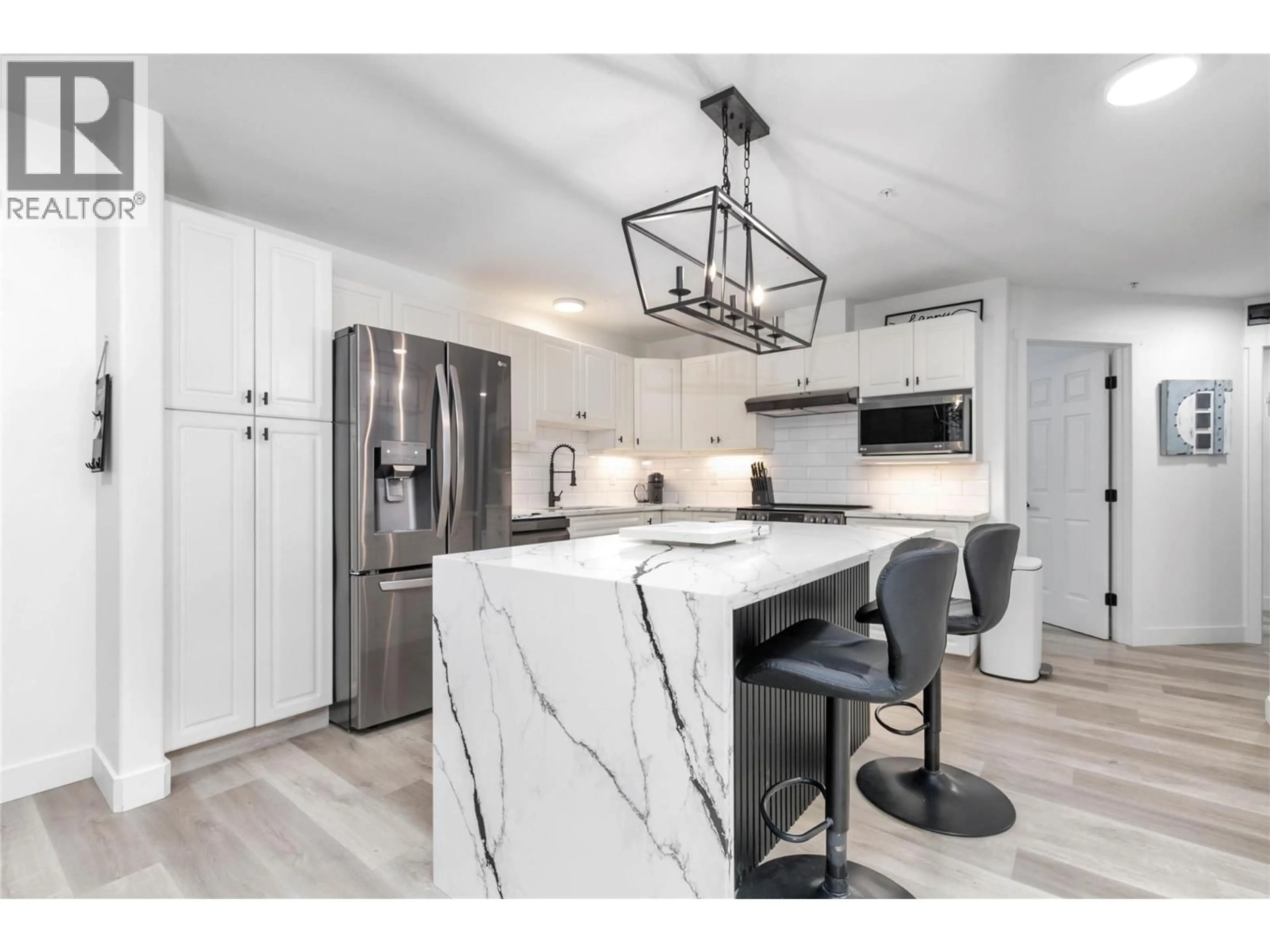Open concept kitchen, ceramic/tile floor for 307 - 1950 DURNIN ROAD, Kelowna British Columbia V1X7W6