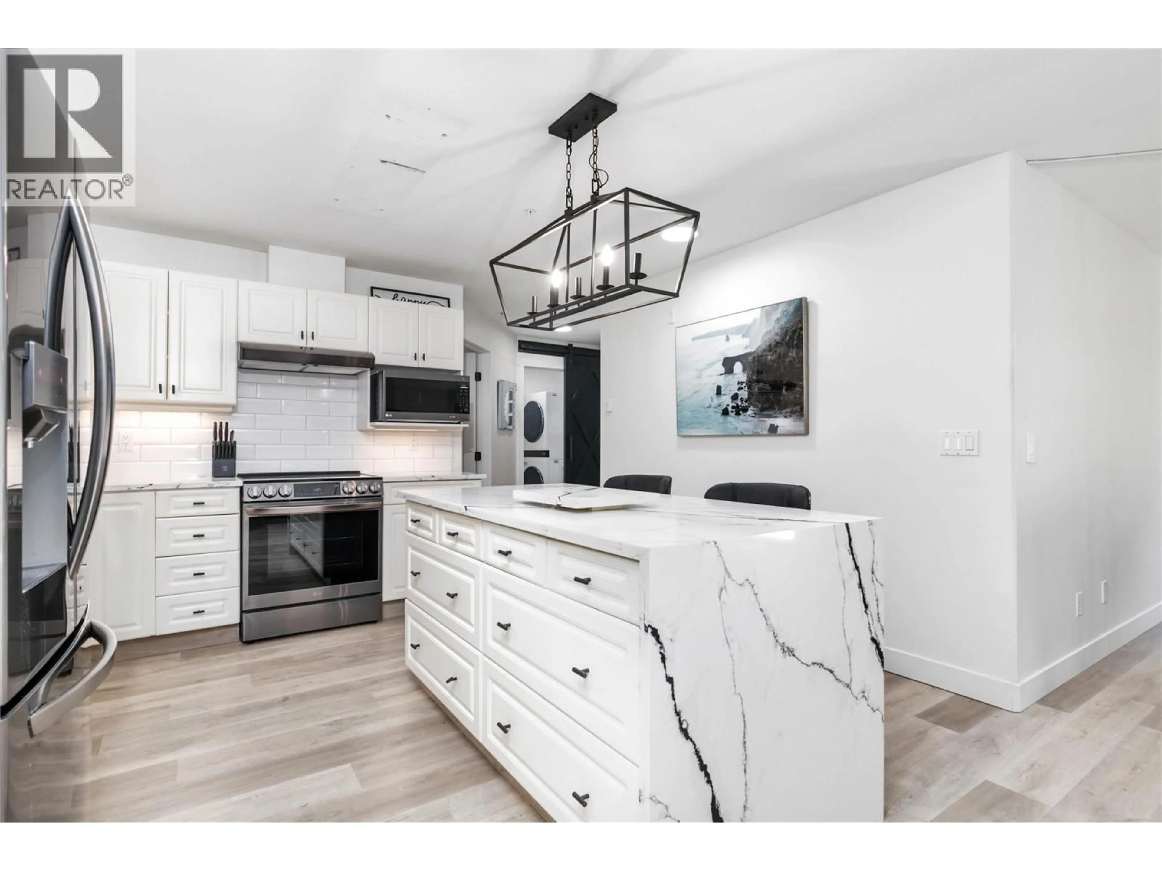Open concept kitchen, ceramic/tile floor for 307 - 1950 DURNIN ROAD, Kelowna British Columbia V1X7W6