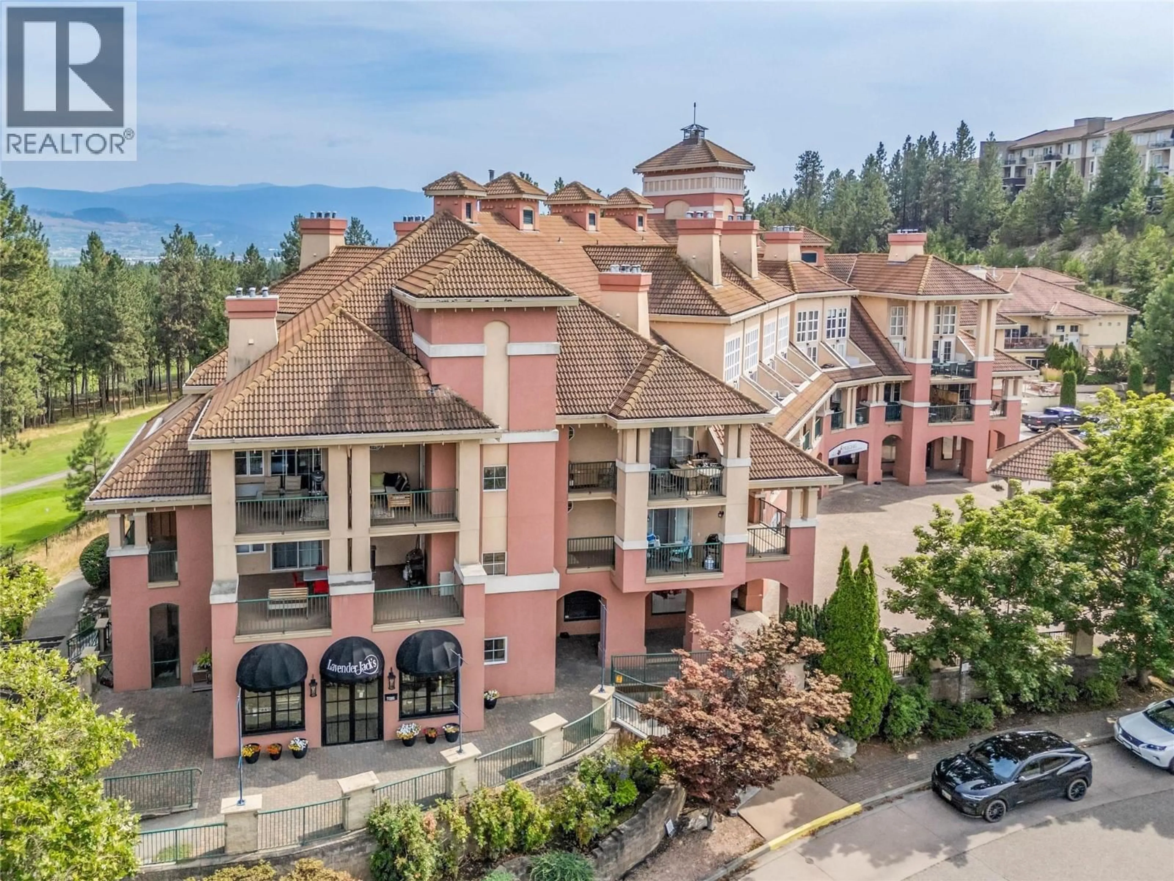 A pic from outside/outdoor area/front of a property/back of a property/a pic from drone, unknown for 101 - 3185 VIA CENTRALE OTHER, Kelowna British Columbia V1V2A7