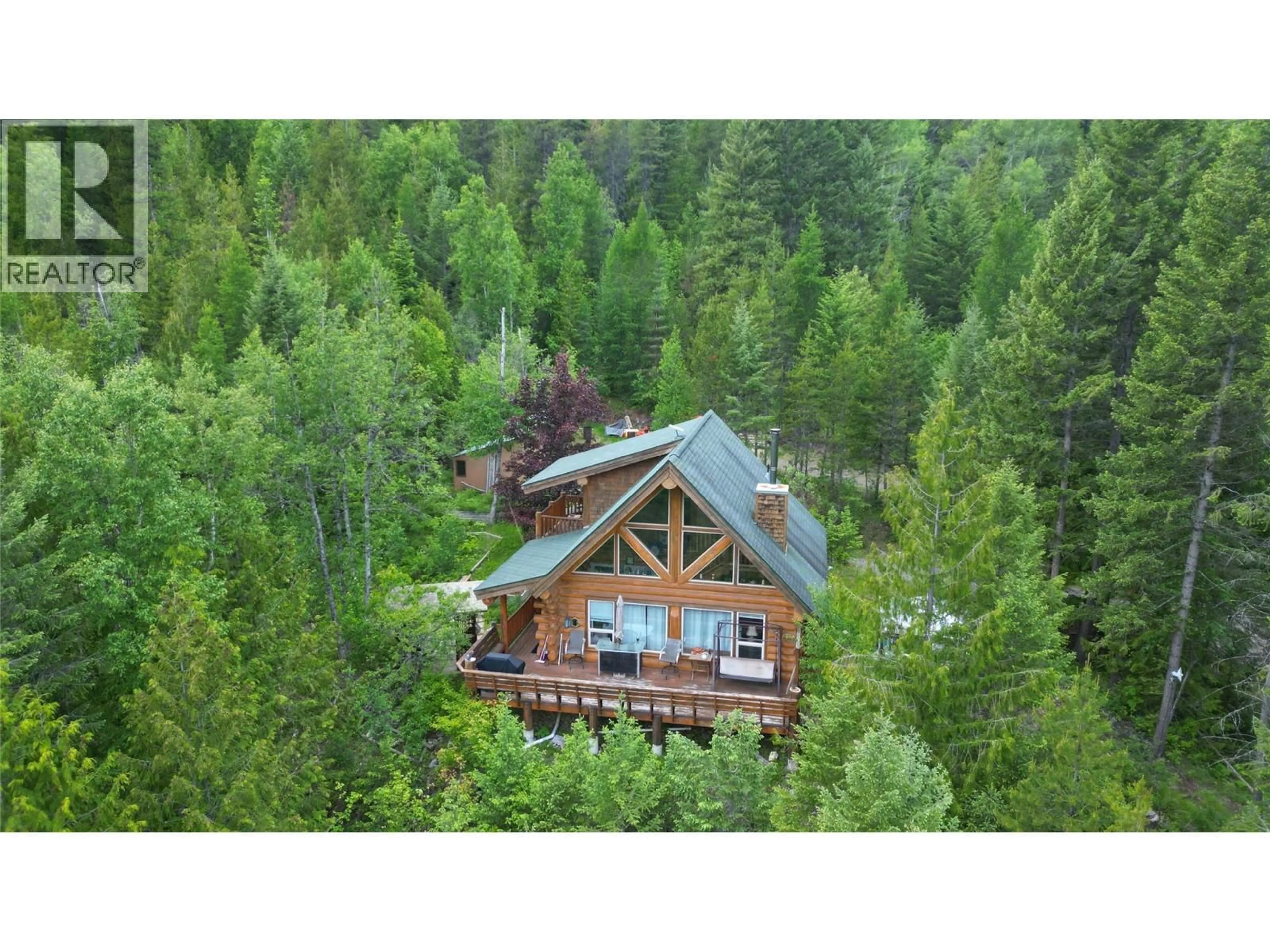 A pic from outside/outdoor area/front of a property/back of a property/a pic from drone, forest/trees view for 2201 3/95 HIGHWAY, Yahk British Columbia V0B2P0