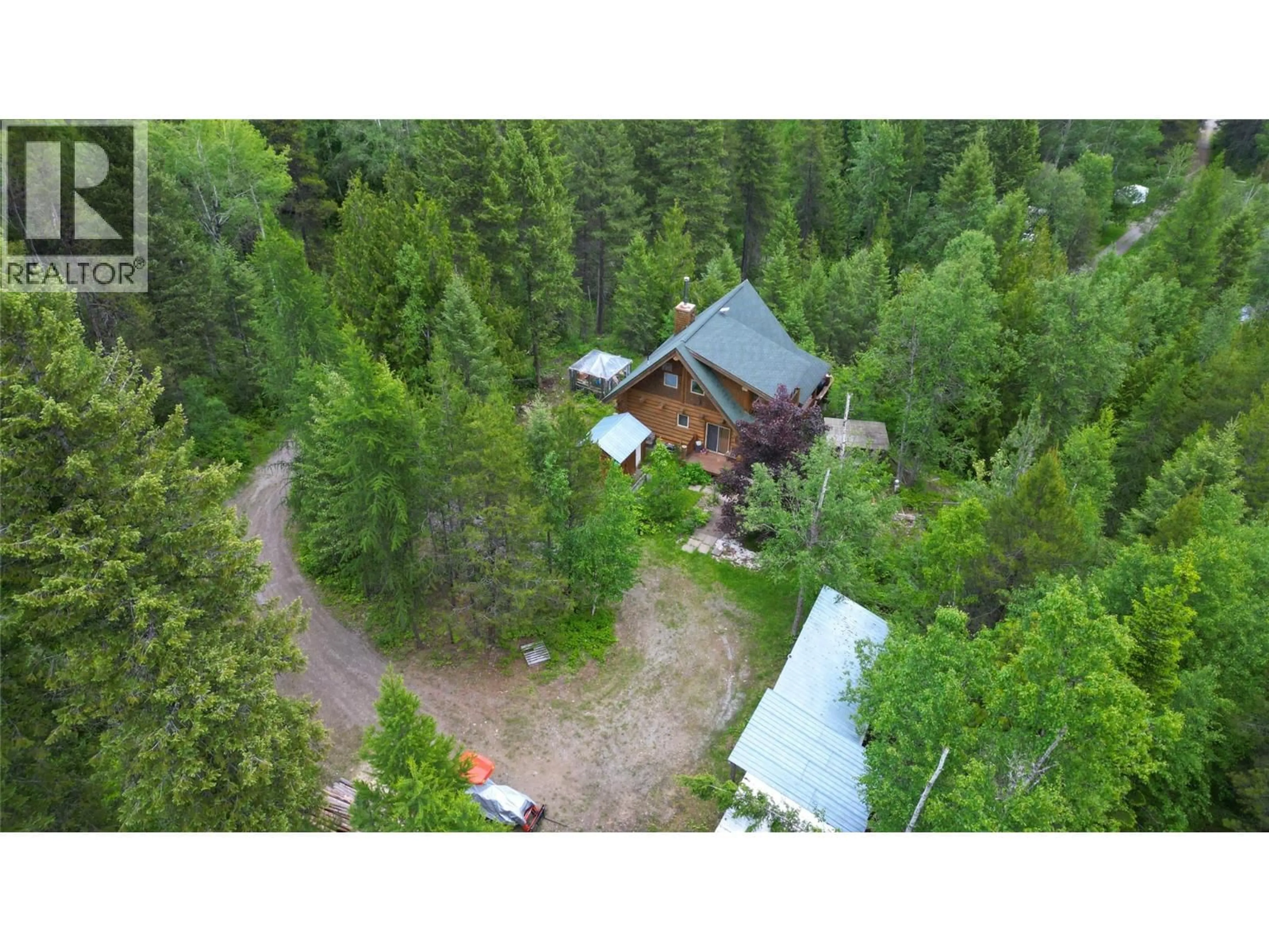 A pic from outside/outdoor area/front of a property/back of a property/a pic from drone, forest/trees view for 2201 3/95 HIGHWAY, Yahk British Columbia V0B2P0