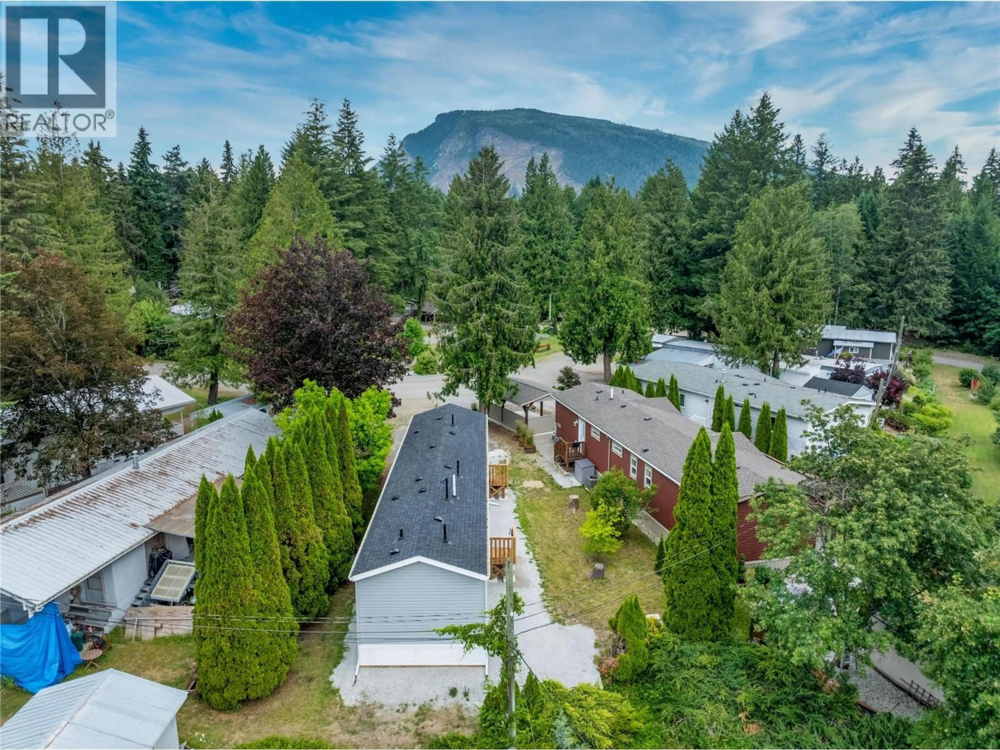 A pic from outside/outdoor area/front of a property/back of a property/a pic from drone, mountain view for 13 - 5161 63 AVENUE NORTHEAST, Salmon Arm British Columbia V0E1K0