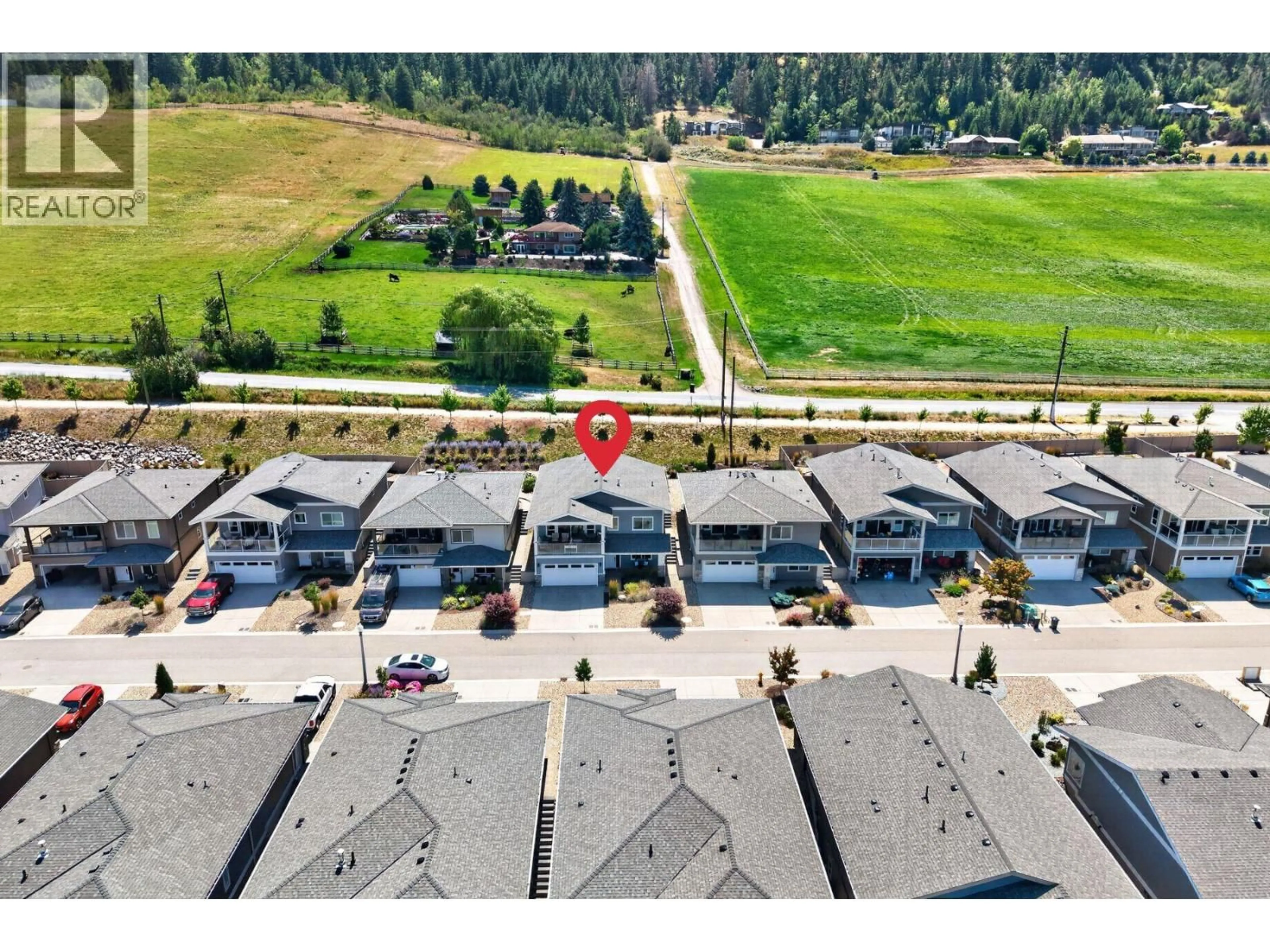A pic from outside/outdoor area/front of a property/back of a property/a pic from drone, mountain view for 133 - 7760 OKANAGAN LANDING ROAD, Vernon British Columbia V1H1Z4
