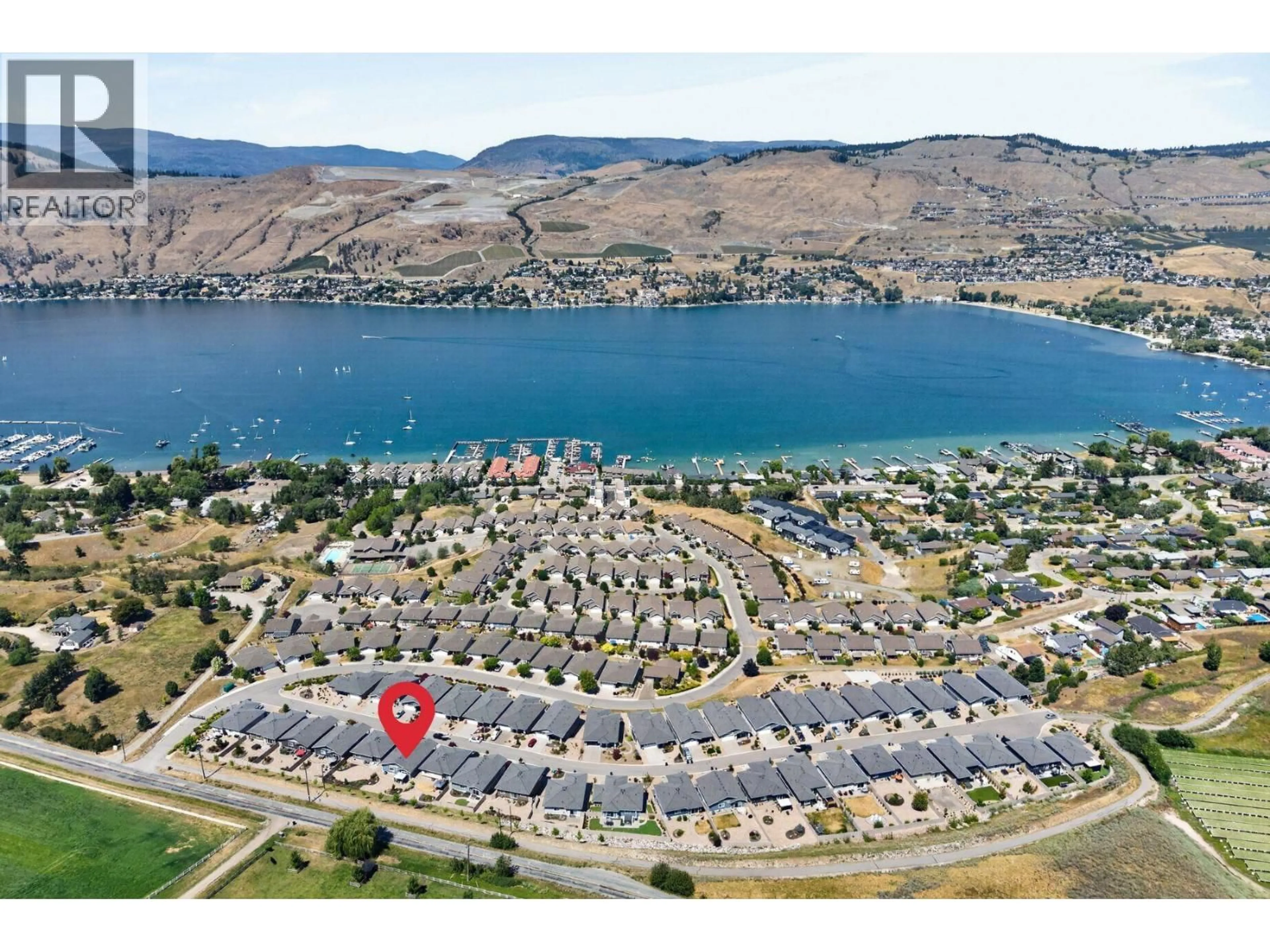 A pic from outside/outdoor area/front of a property/back of a property/a pic from drone, water/lake/river/ocean view for 133 - 7760 OKANAGAN LANDING ROAD, Vernon British Columbia V1H1Z4
