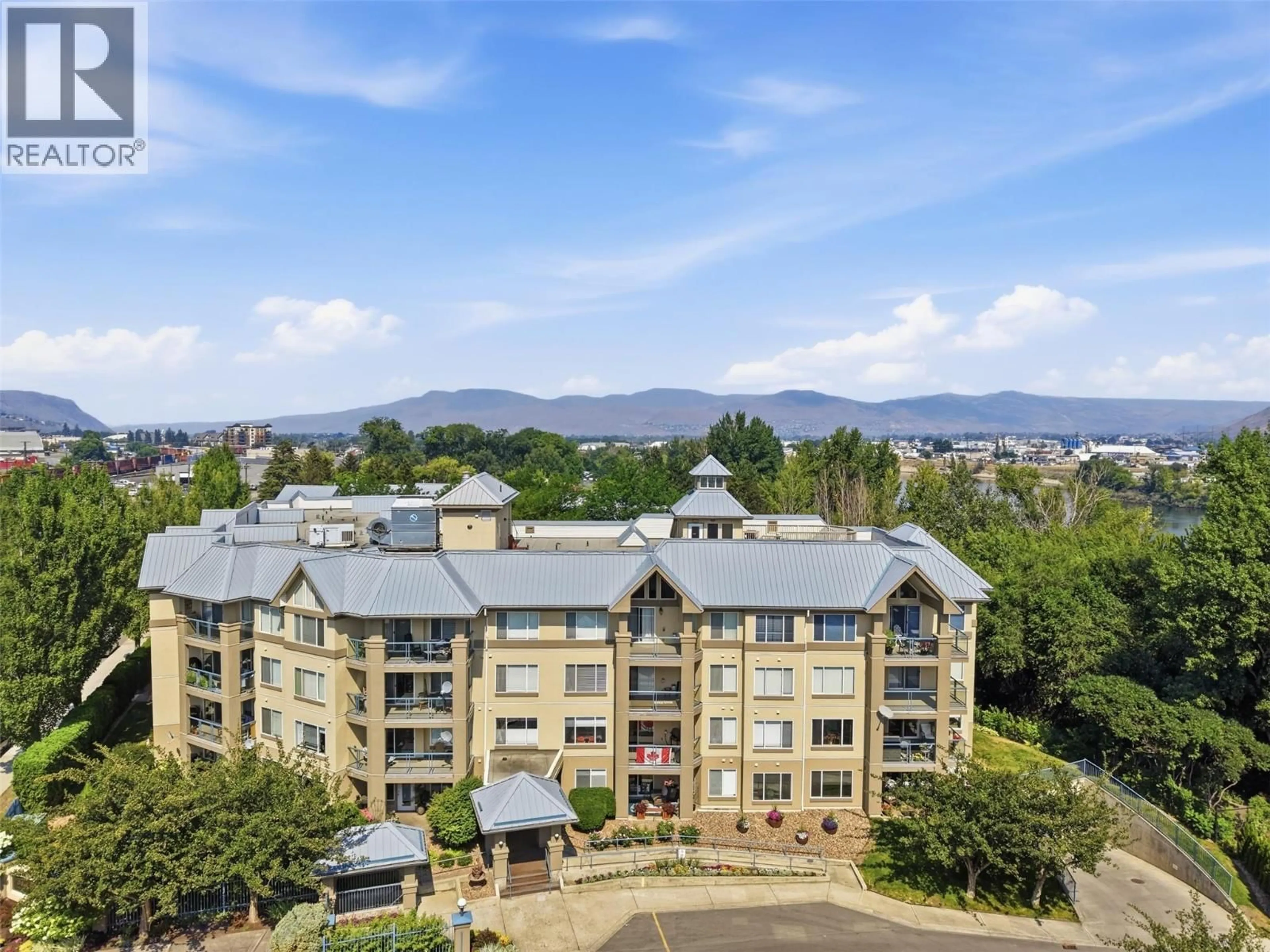 A pic from outside/outdoor area/front of a property/back of a property/a pic from drone, mountain view for 104 - 950 LORNE STREET, Kamloops British Columbia V2C1W9
