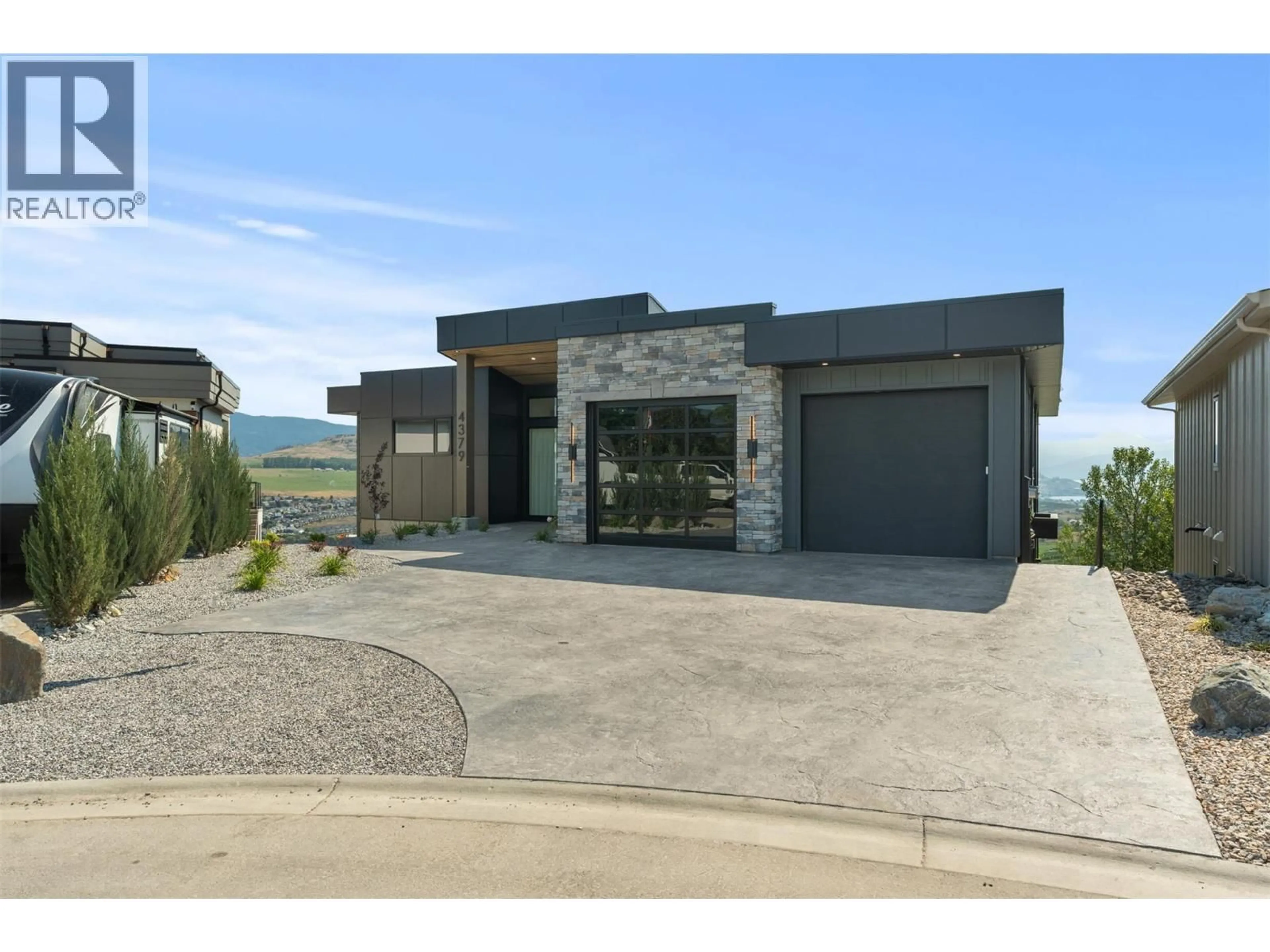 Home with brick exterior material, unknown for 4379 PAINTED TURTLE DRIVE, Vernon British Columbia V1T9W4