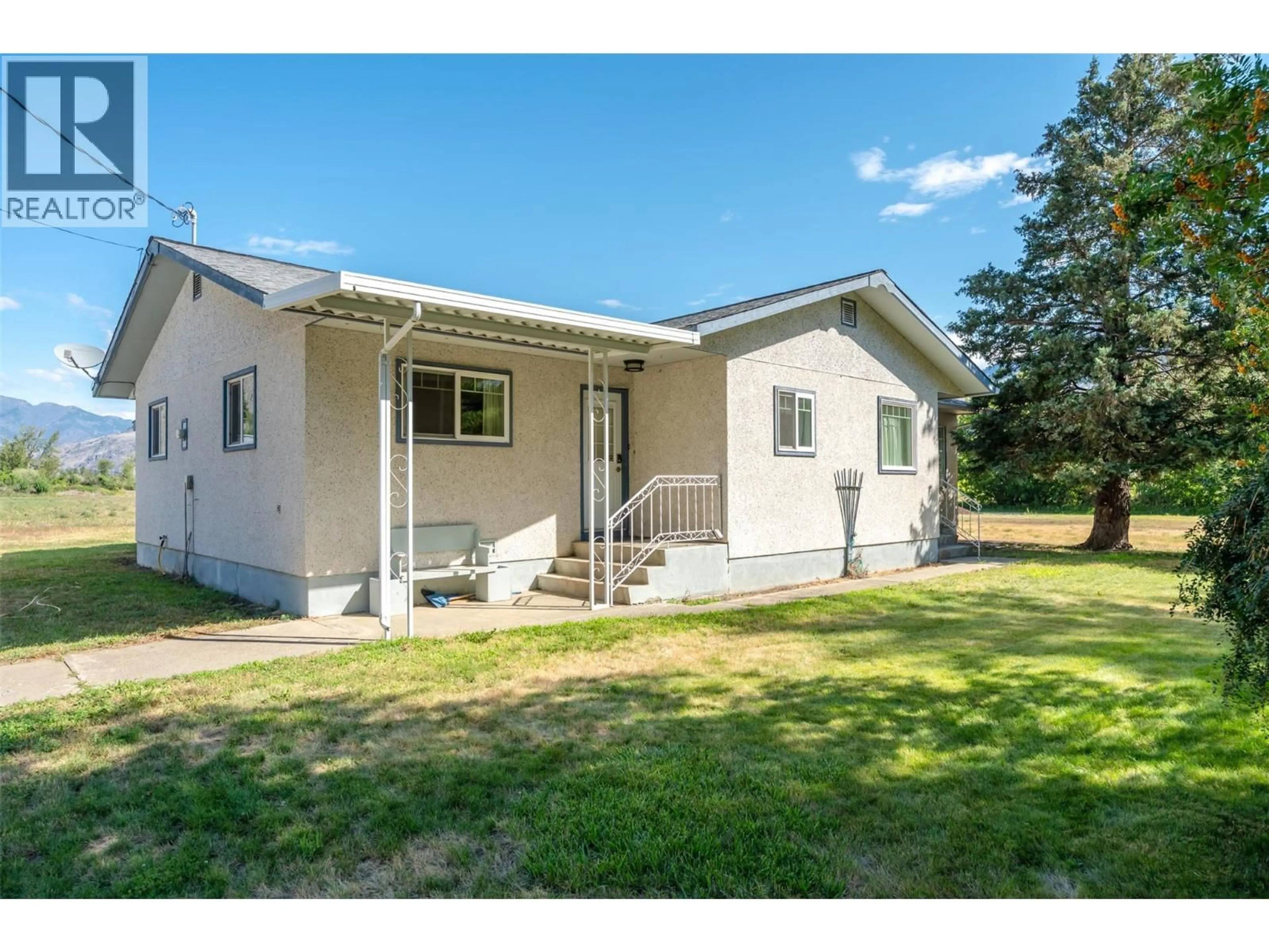 Home with vinyl exterior material, street for 249 COULTHARD ROAD, Cawston British Columbia V0X1C1