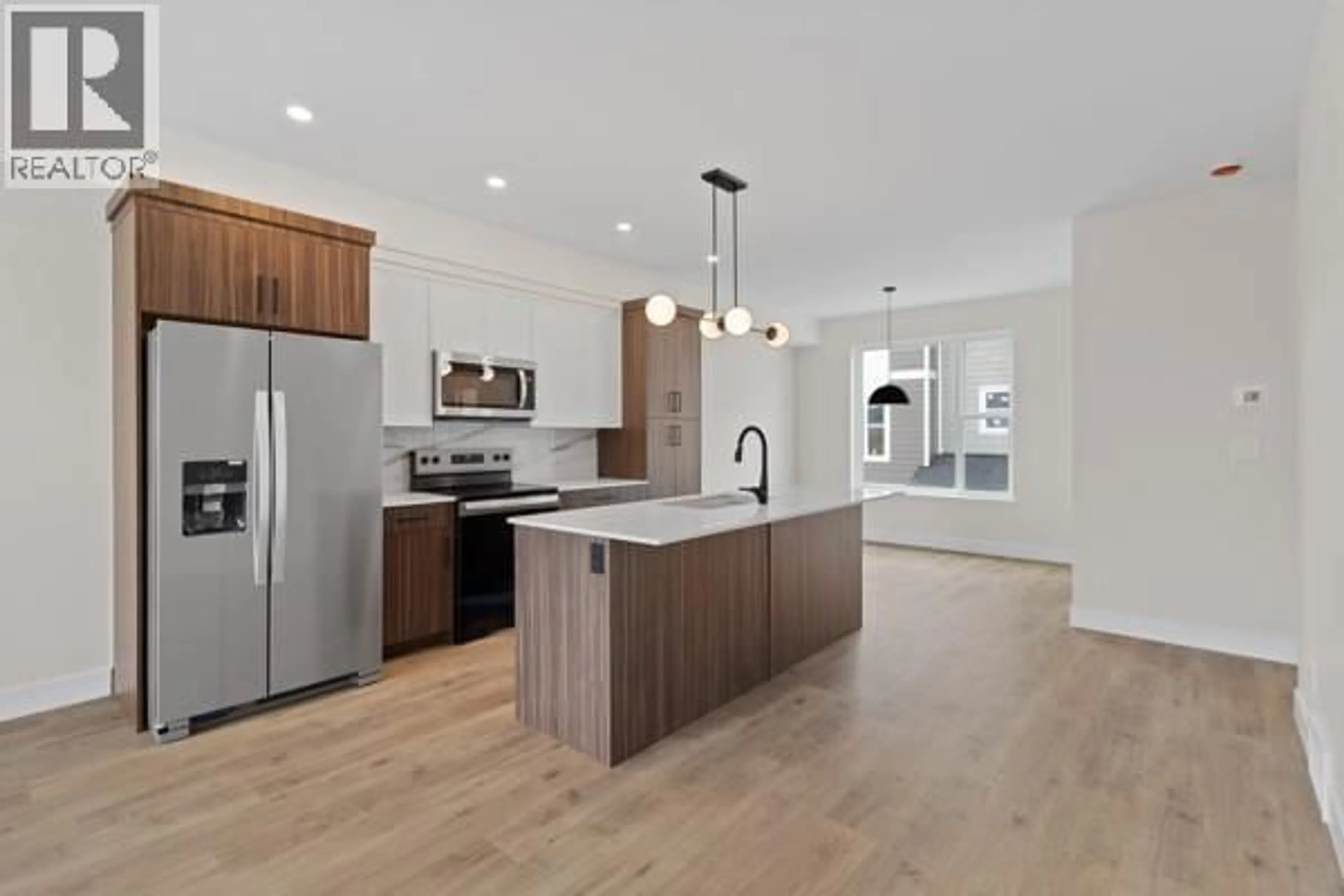 Open concept kitchen, wood/laminate floor for 117 - 2686 TRANQUILLE ROAD, Kamloops British Columbia V2B3P1