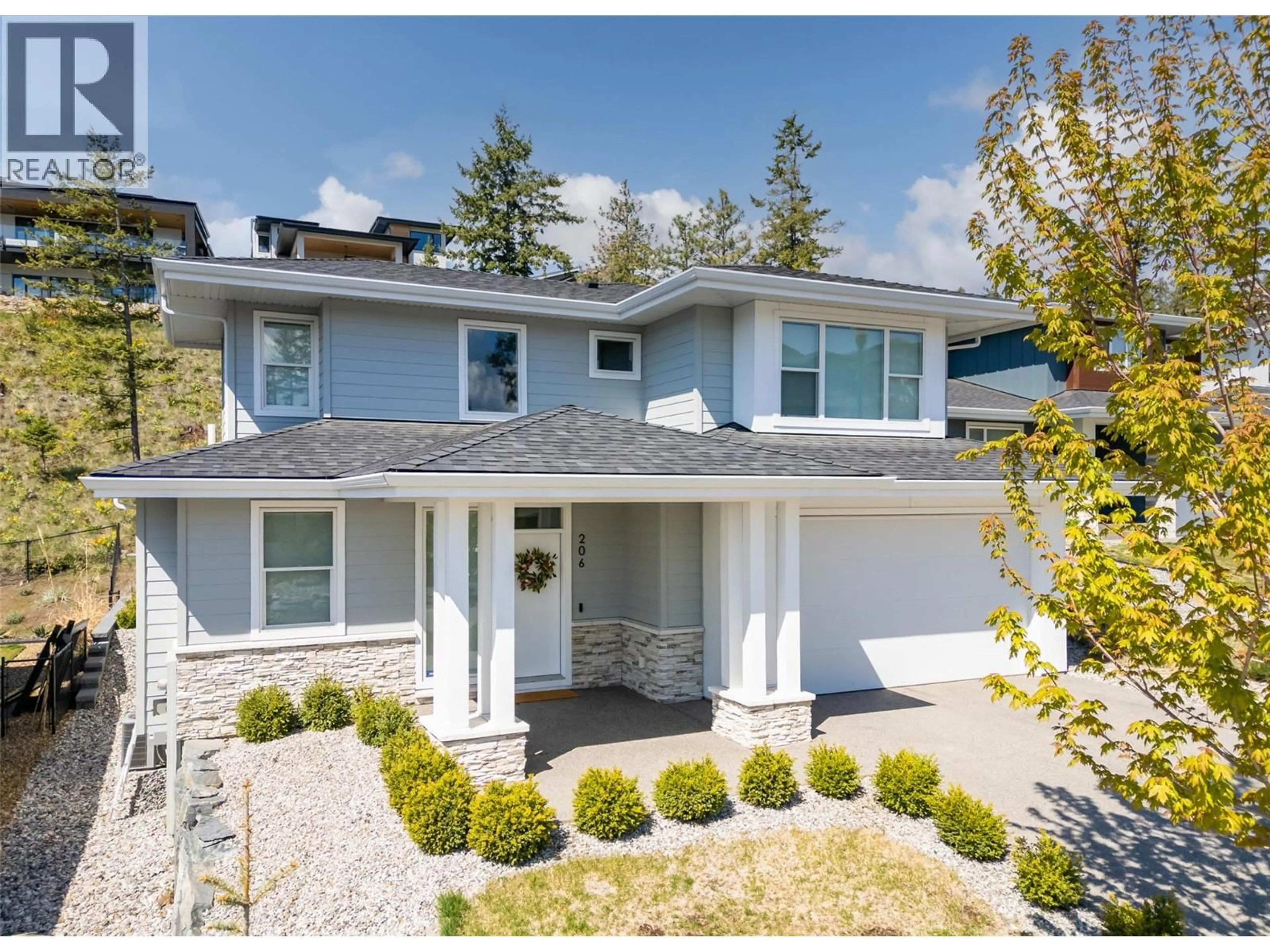 Home with vinyl exterior material, street for 206 ECHO RIDGE, Kelowna British Columbia V1V0C9